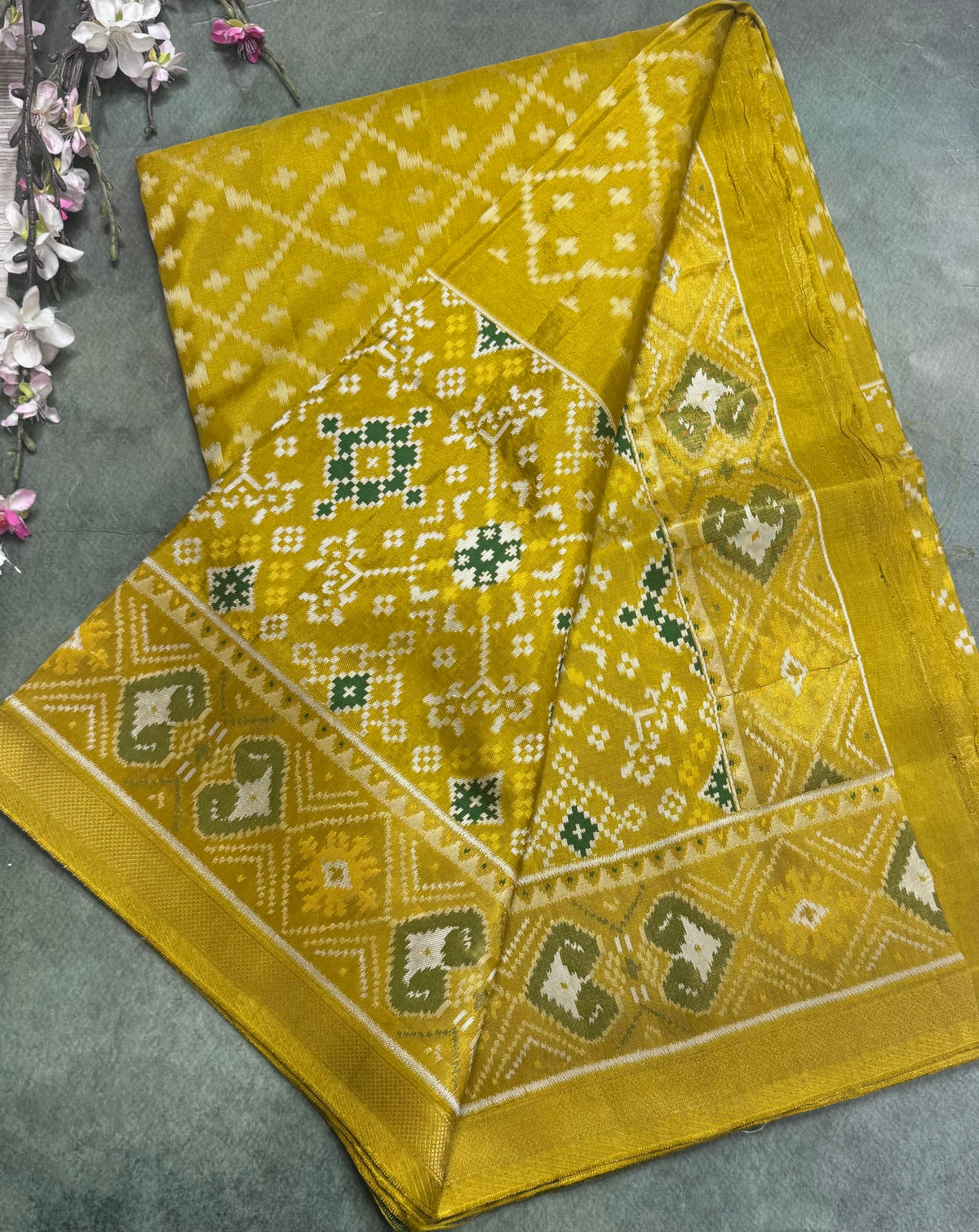 Mustard yellow small border semi patola saree 111
