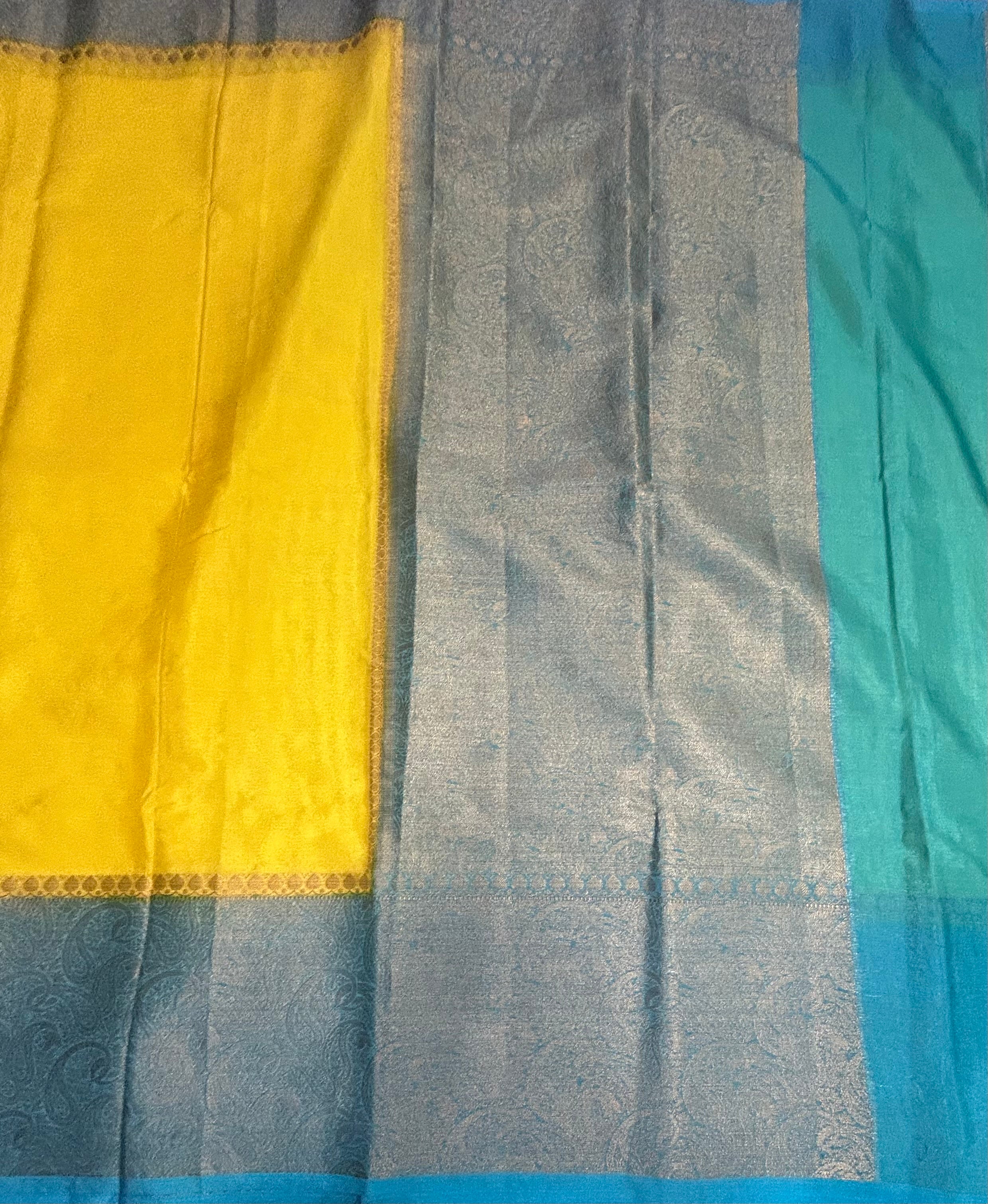 Bright yellow Kanchi border Semi Kanchi saree
