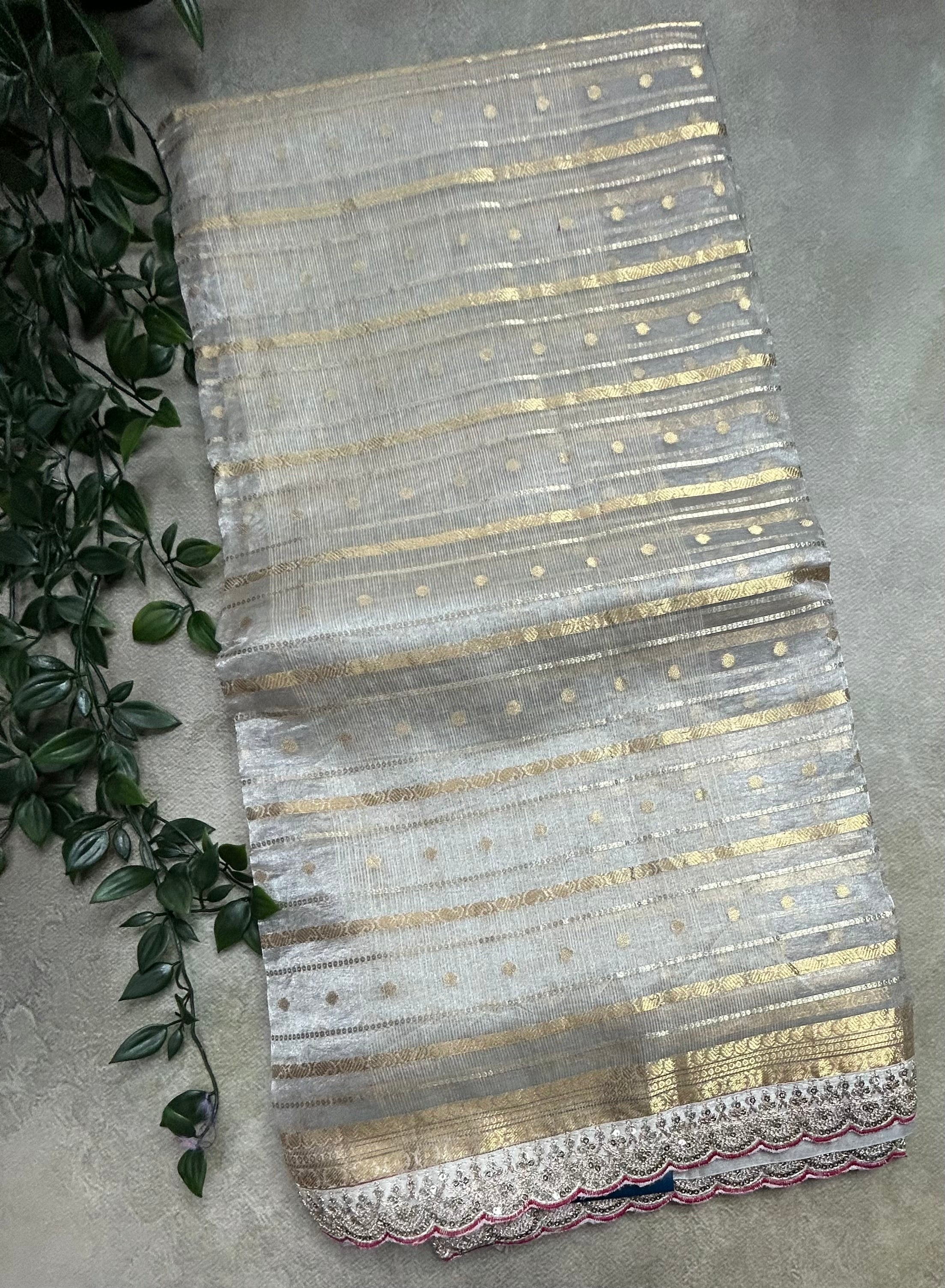 Cream tissue brocade party wear scallop border saree