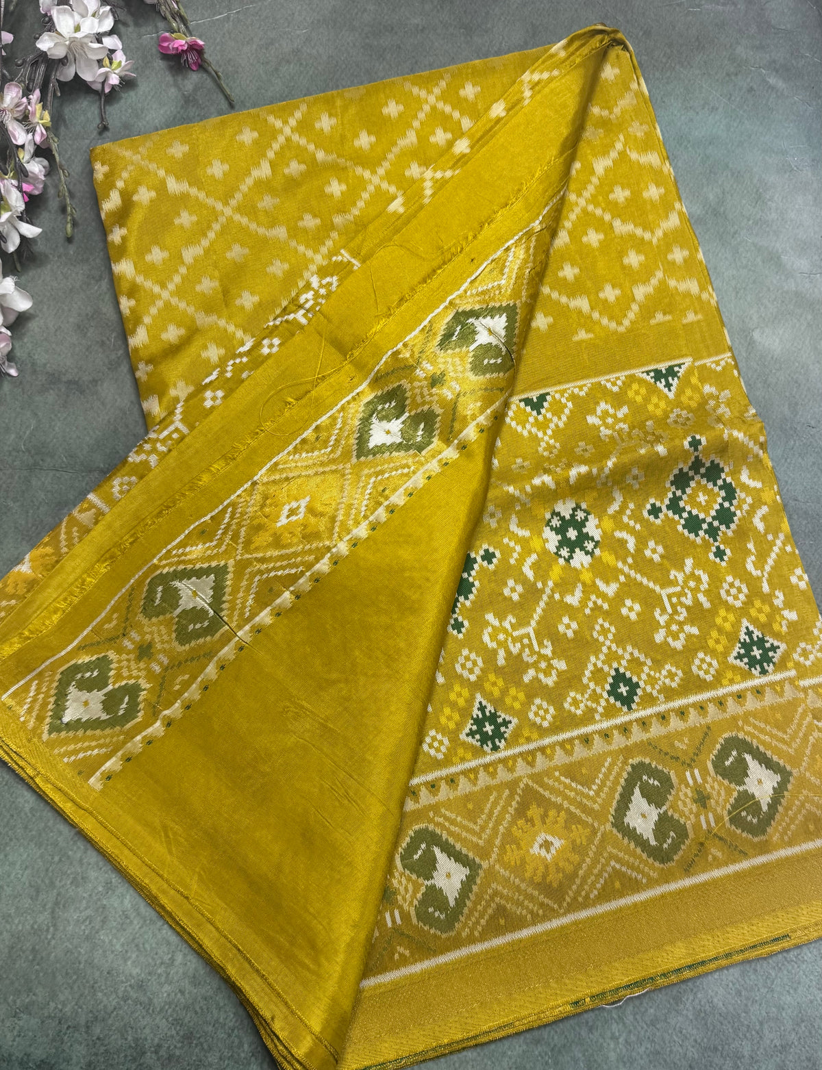 Mustard yellow small border semi patola saree 111