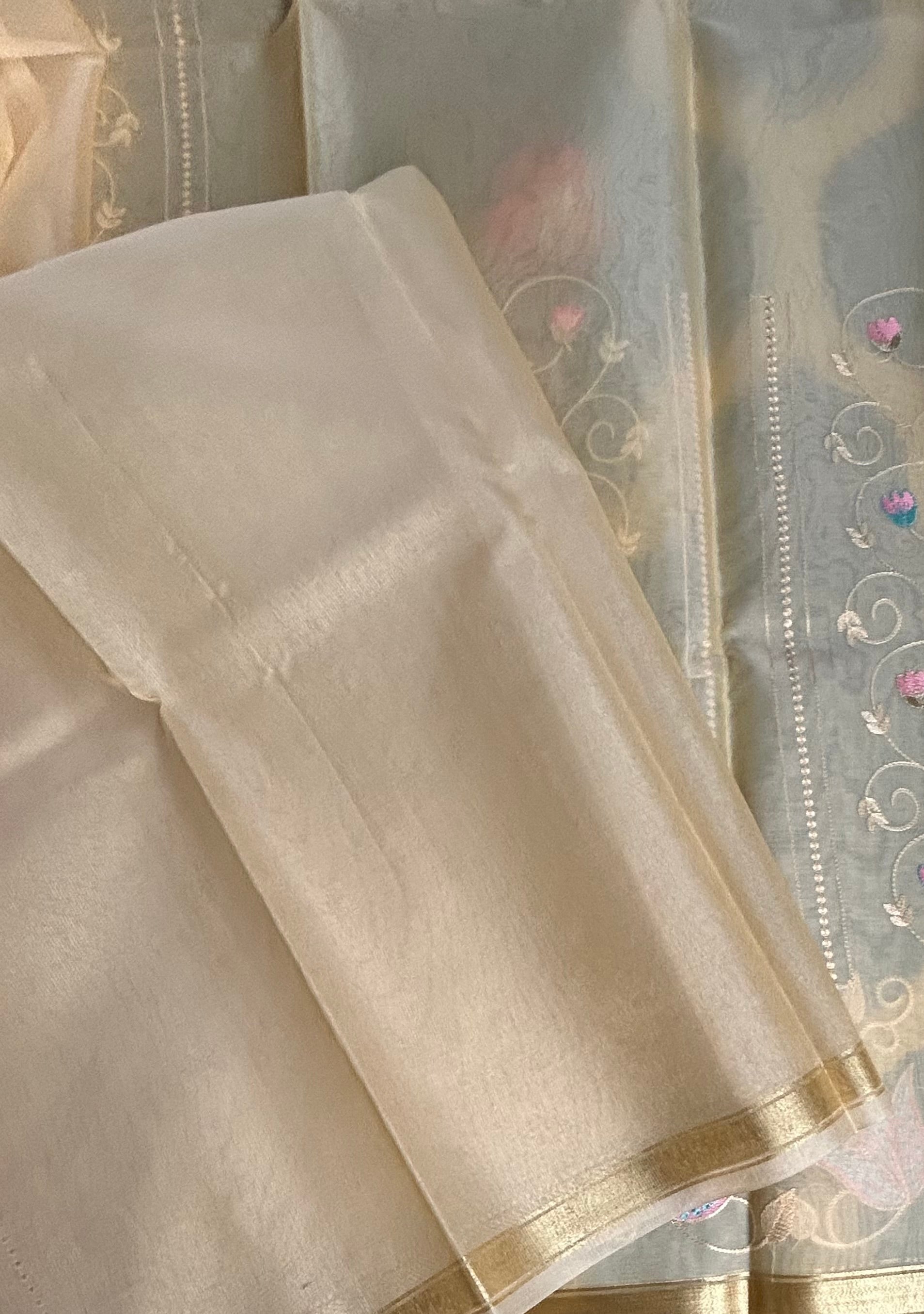Peach embroidery semi tissue saree