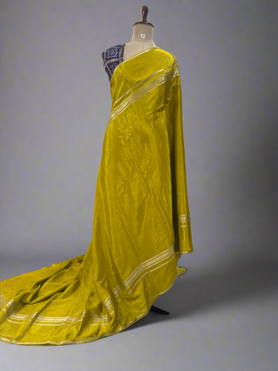 Mustard yellow plain four border semi mysore crepe saree