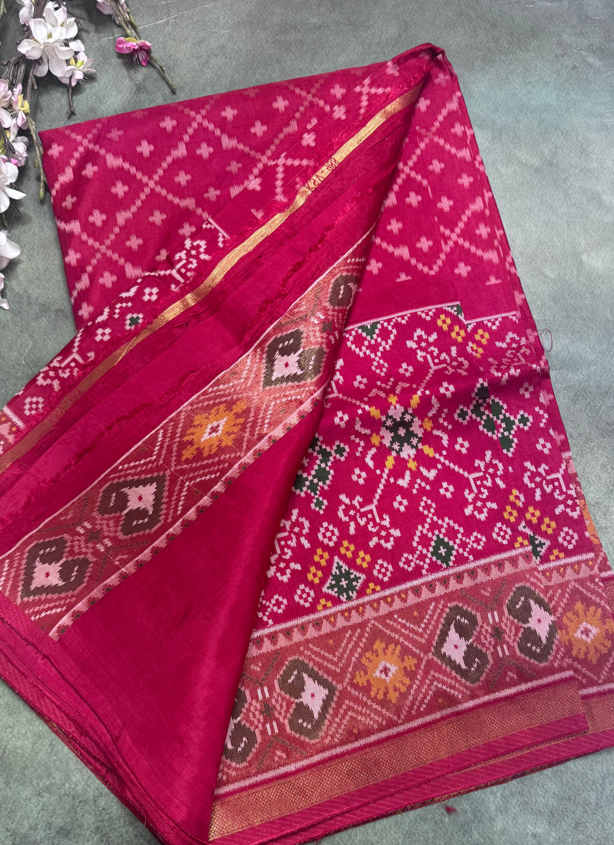 Rani pink small border semi patola saree 111