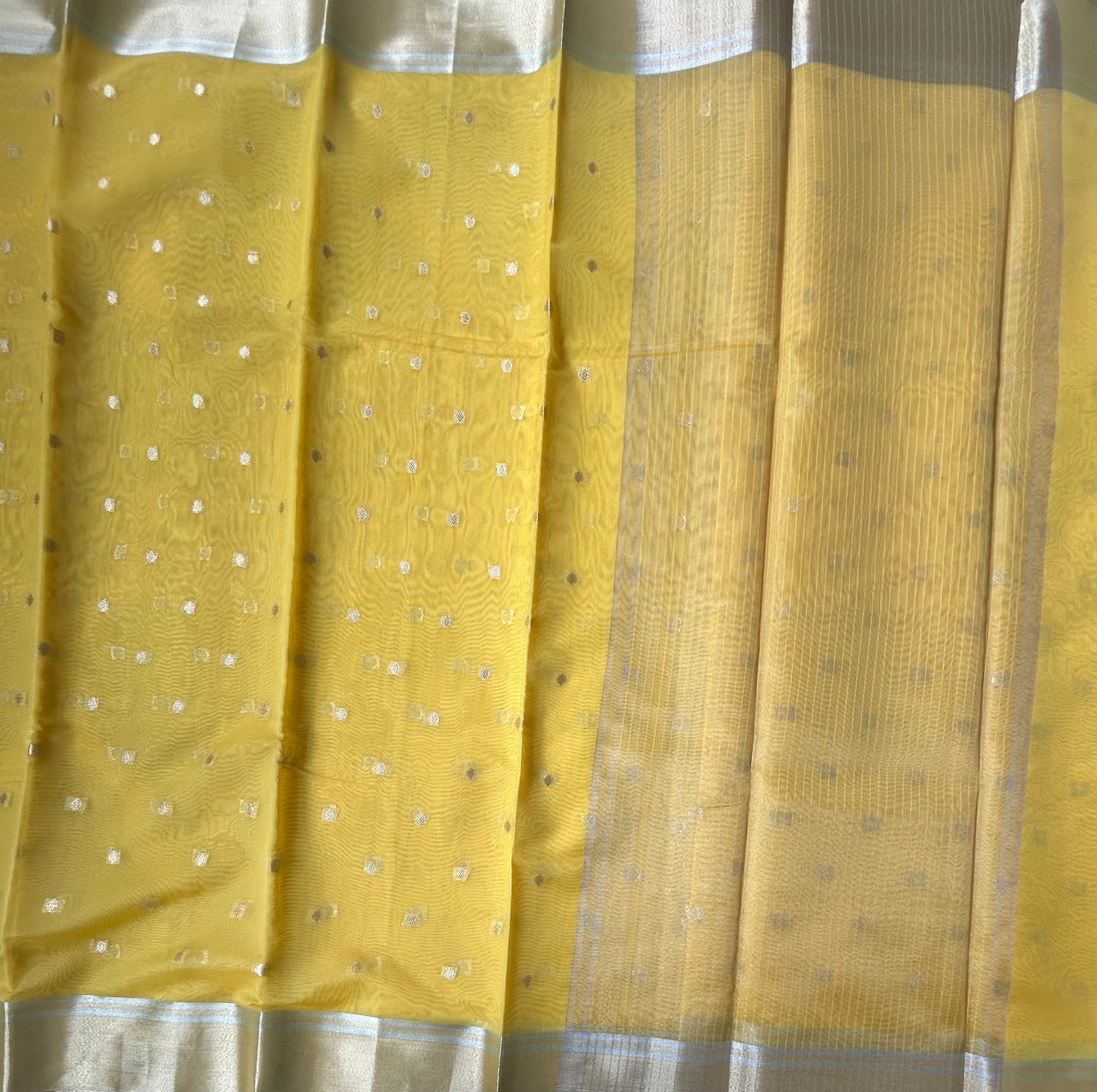 Yellow contrast border semi tissue saree