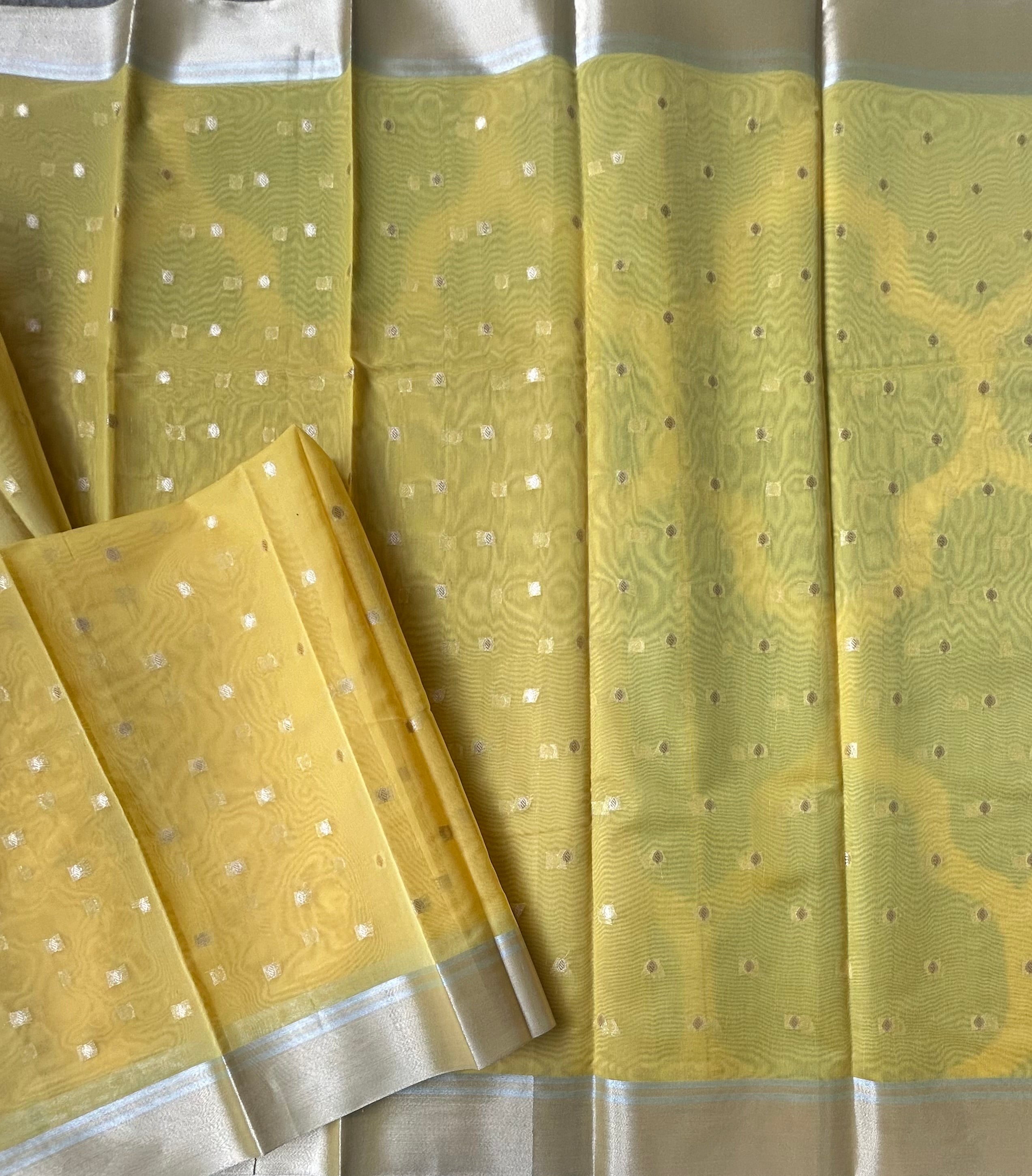 Yellow contrast border semi tissue saree