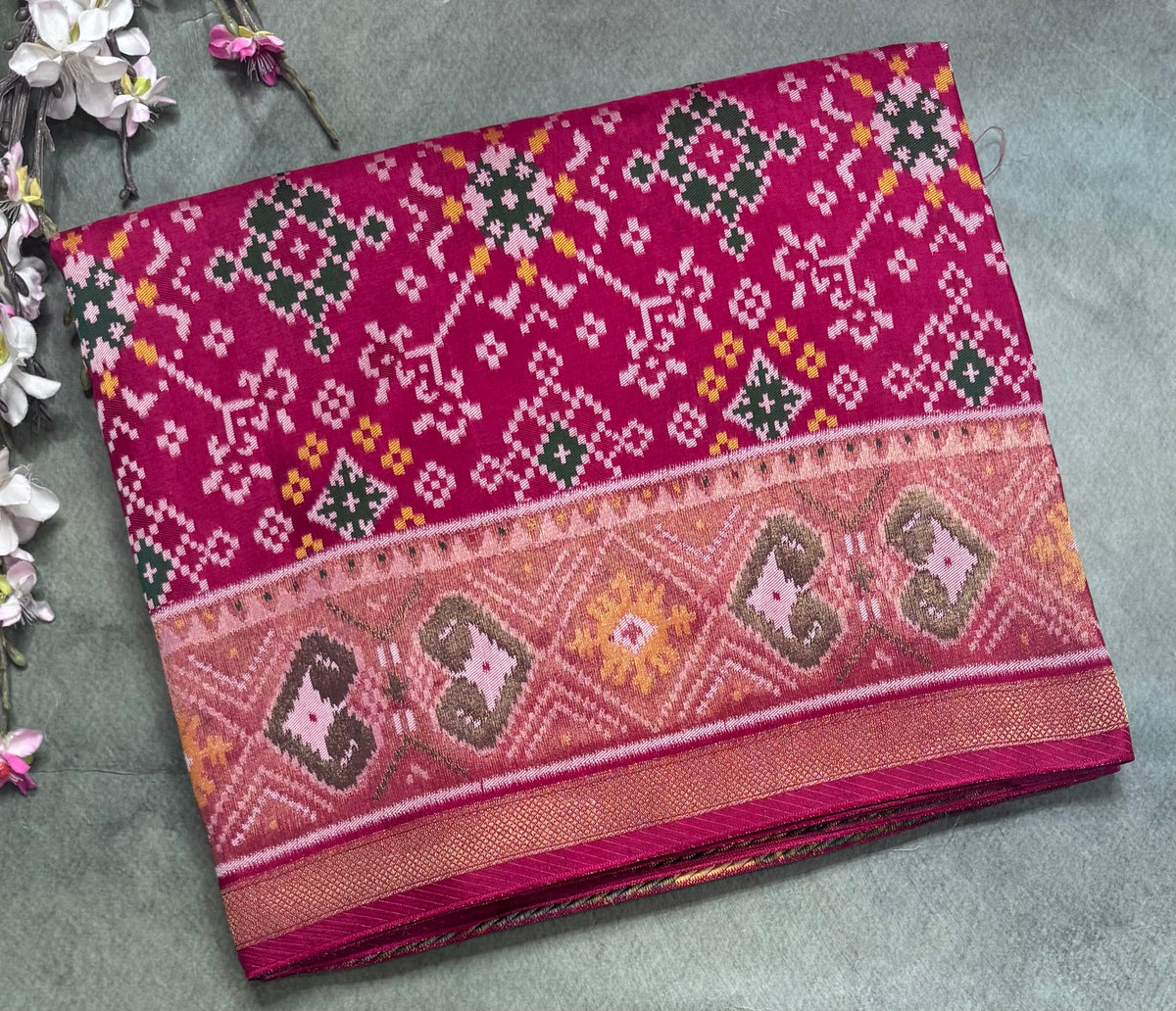 Rani pink small border semi patola saree 111
