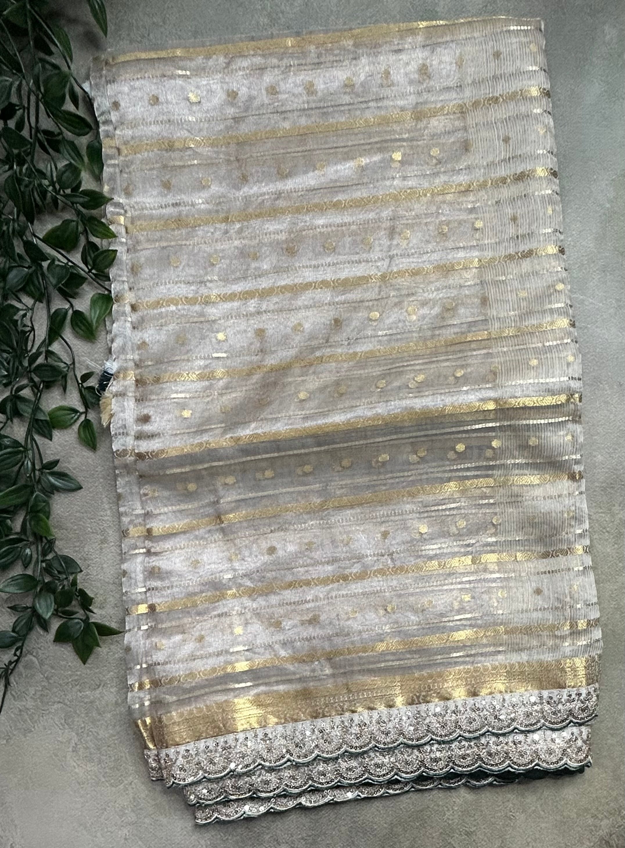 Cream tissue brocade party wear scallop border saree