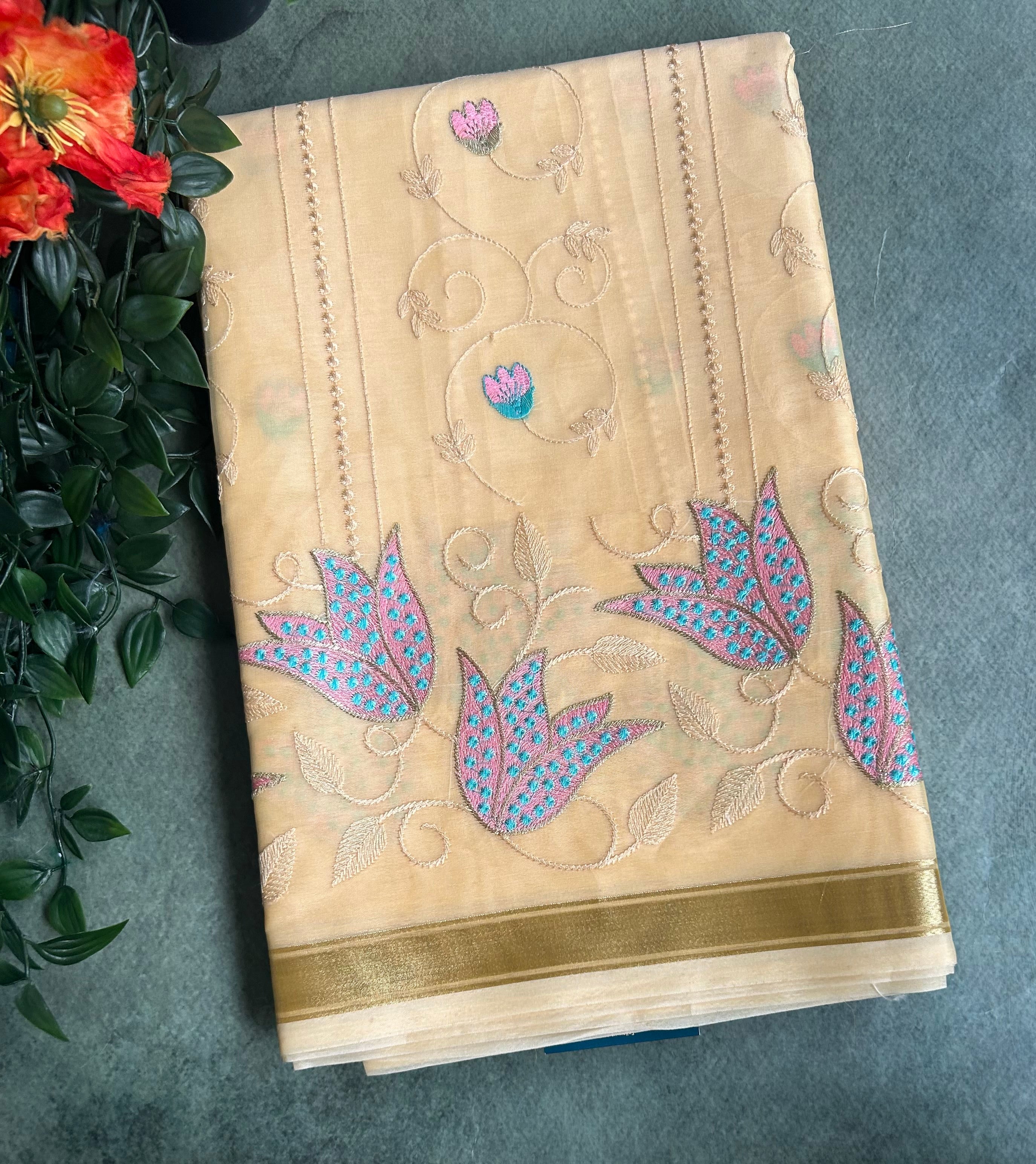 Peach embroidery semi tissue saree
