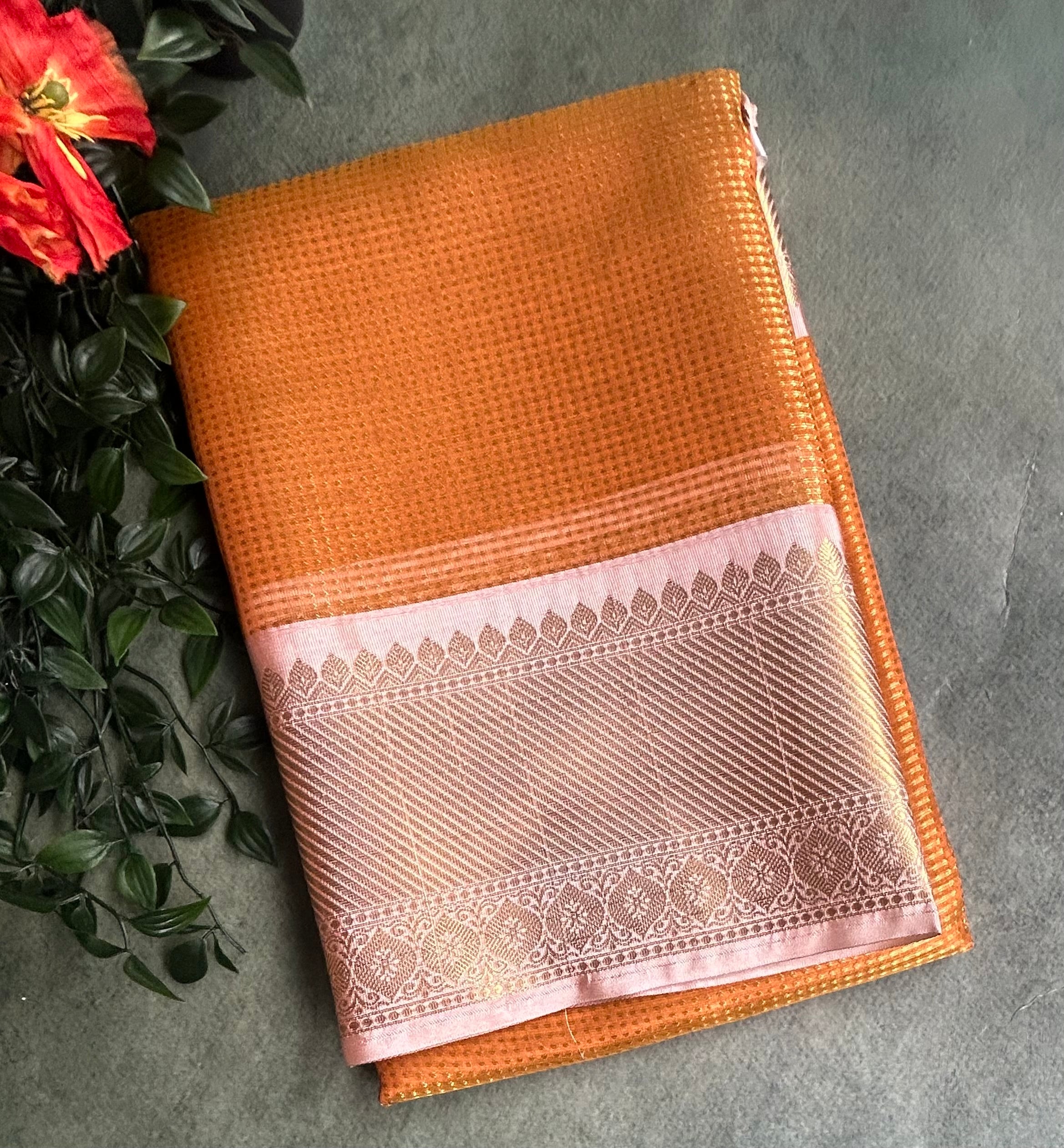 Orange brocade semi tissue saree