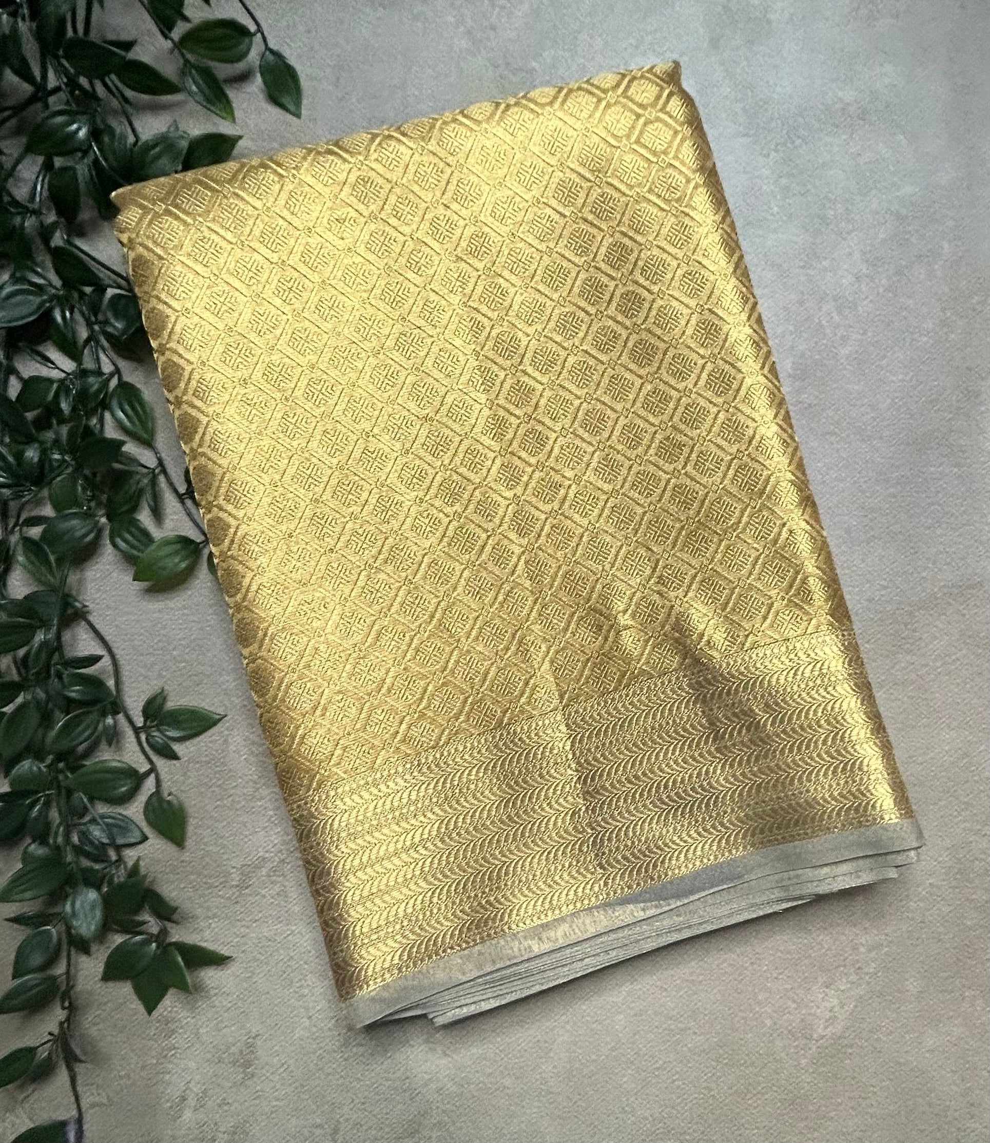 Gold self brocade semi tissue saree