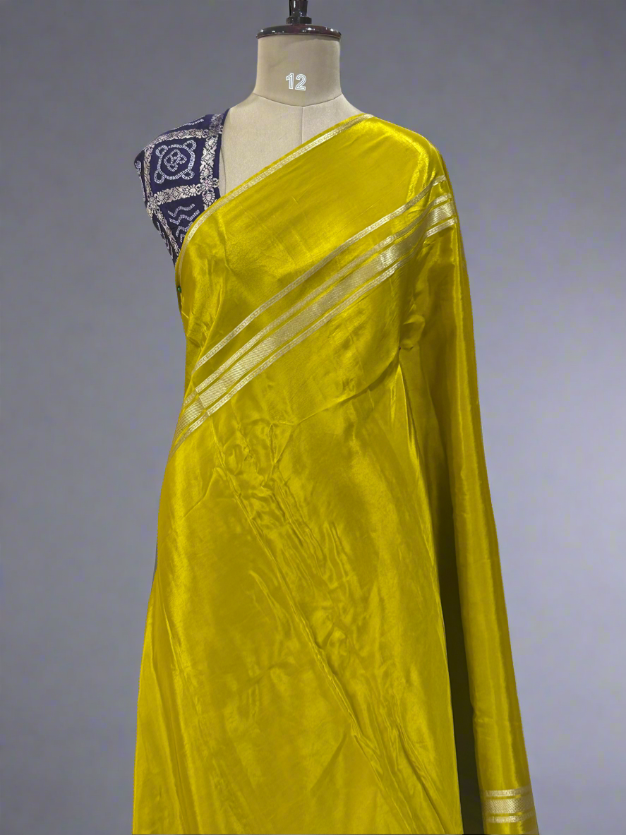 Mustard yellow plain four border semi mysore crepe saree