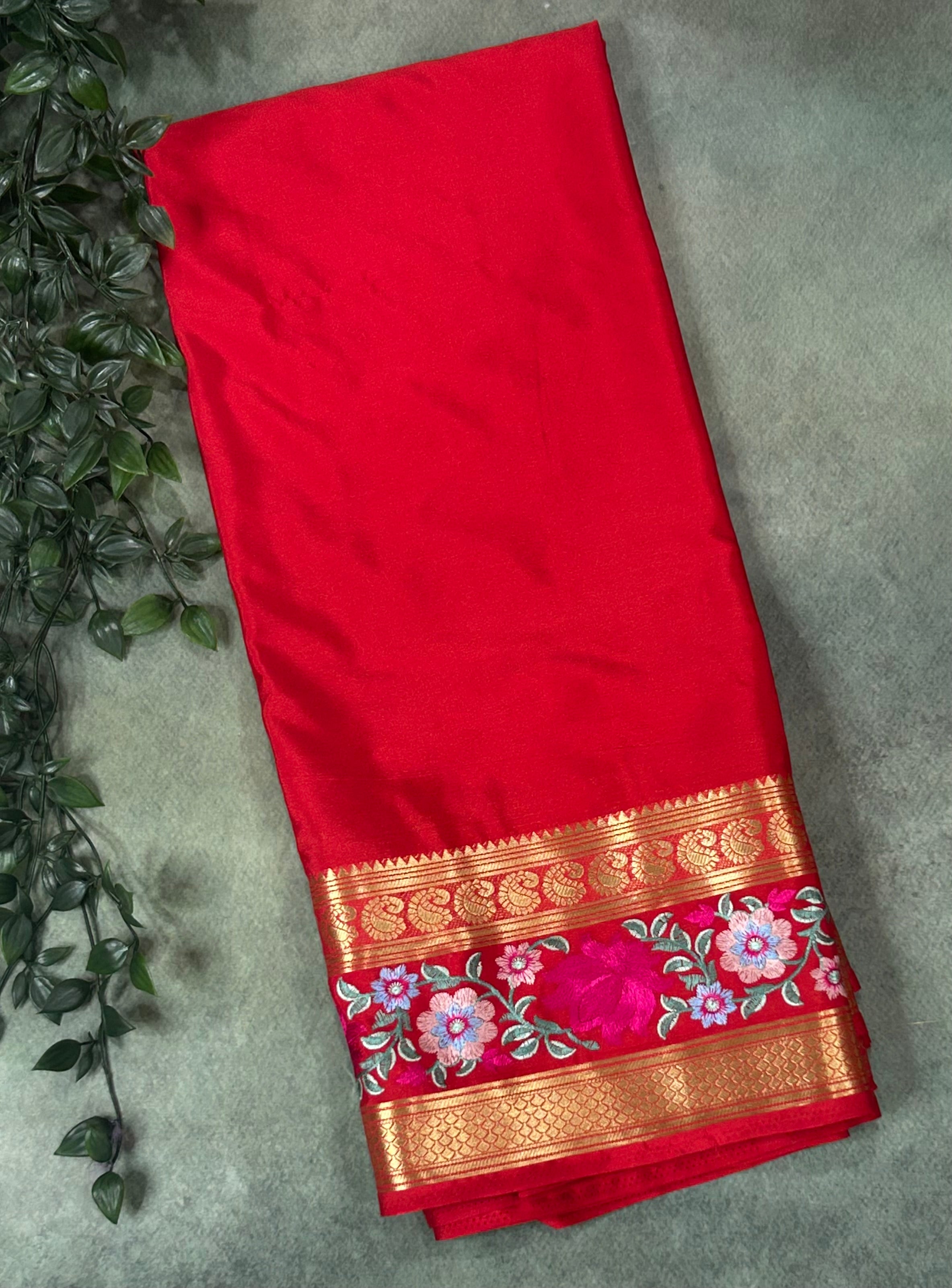 Red embroidery work satin crepe saree