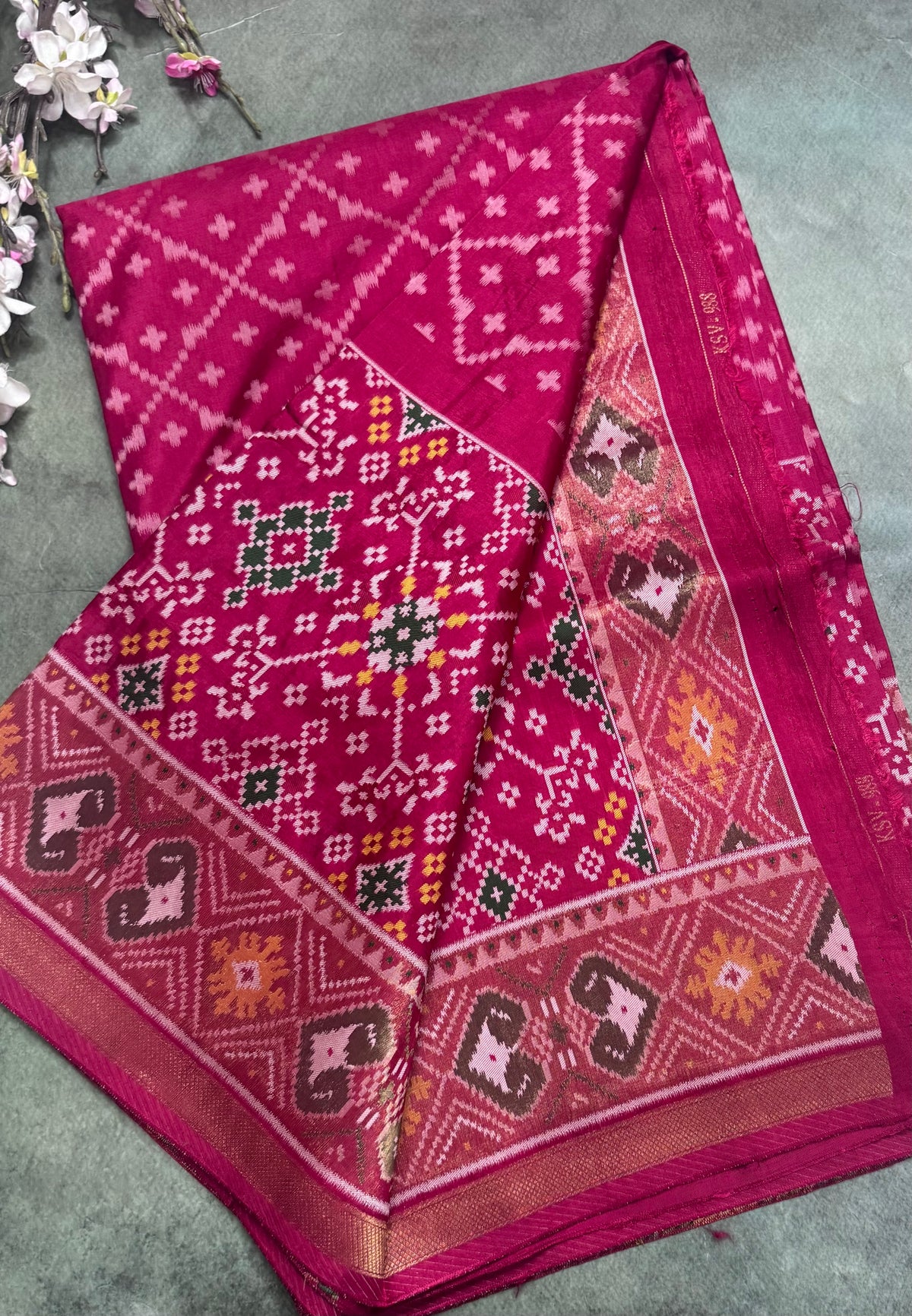 Rani pink small border semi patola saree 111