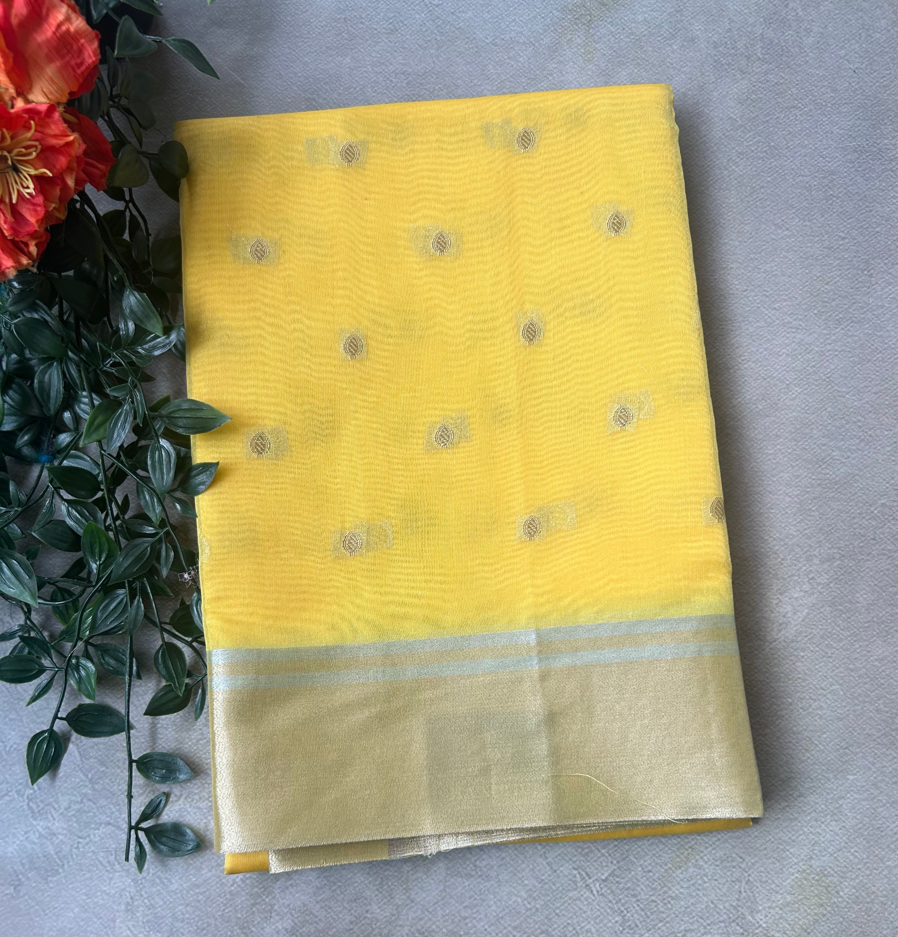 Yellow contrast border semi tissue saree