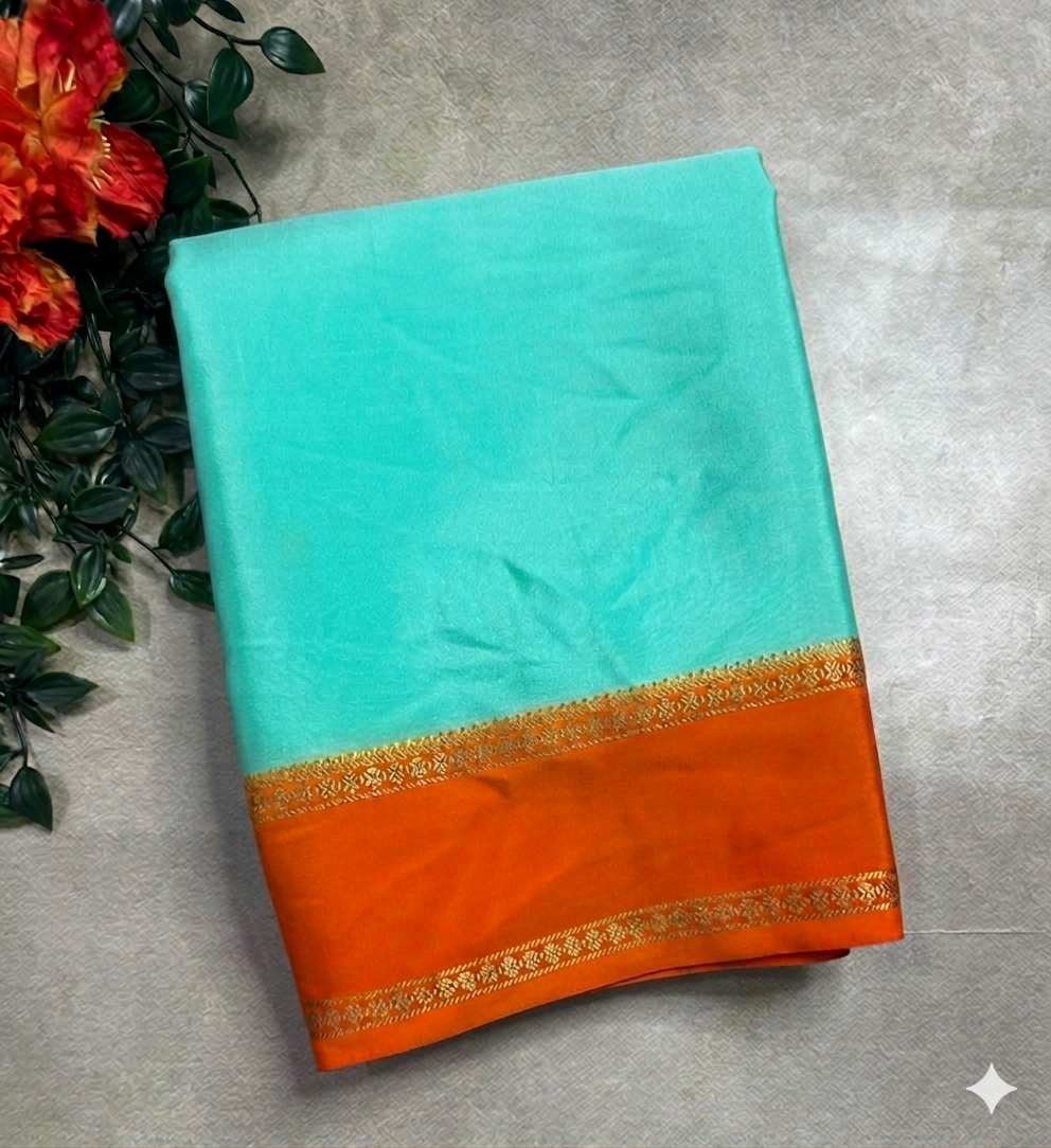 Distemper blue n orange plain bentex border pure mysore silk 105 saree