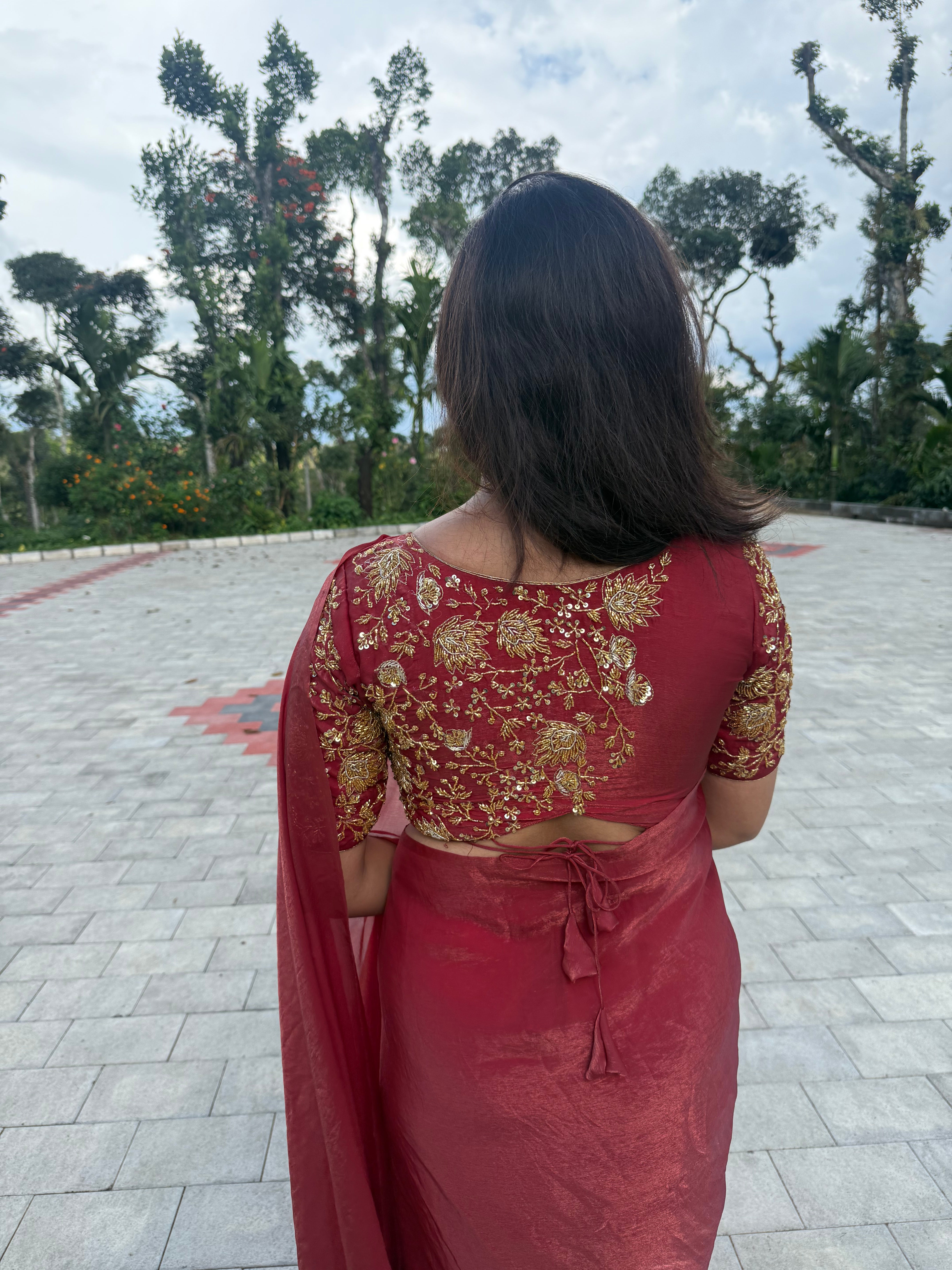 Arpitha red party wear with heavy work blouse saree