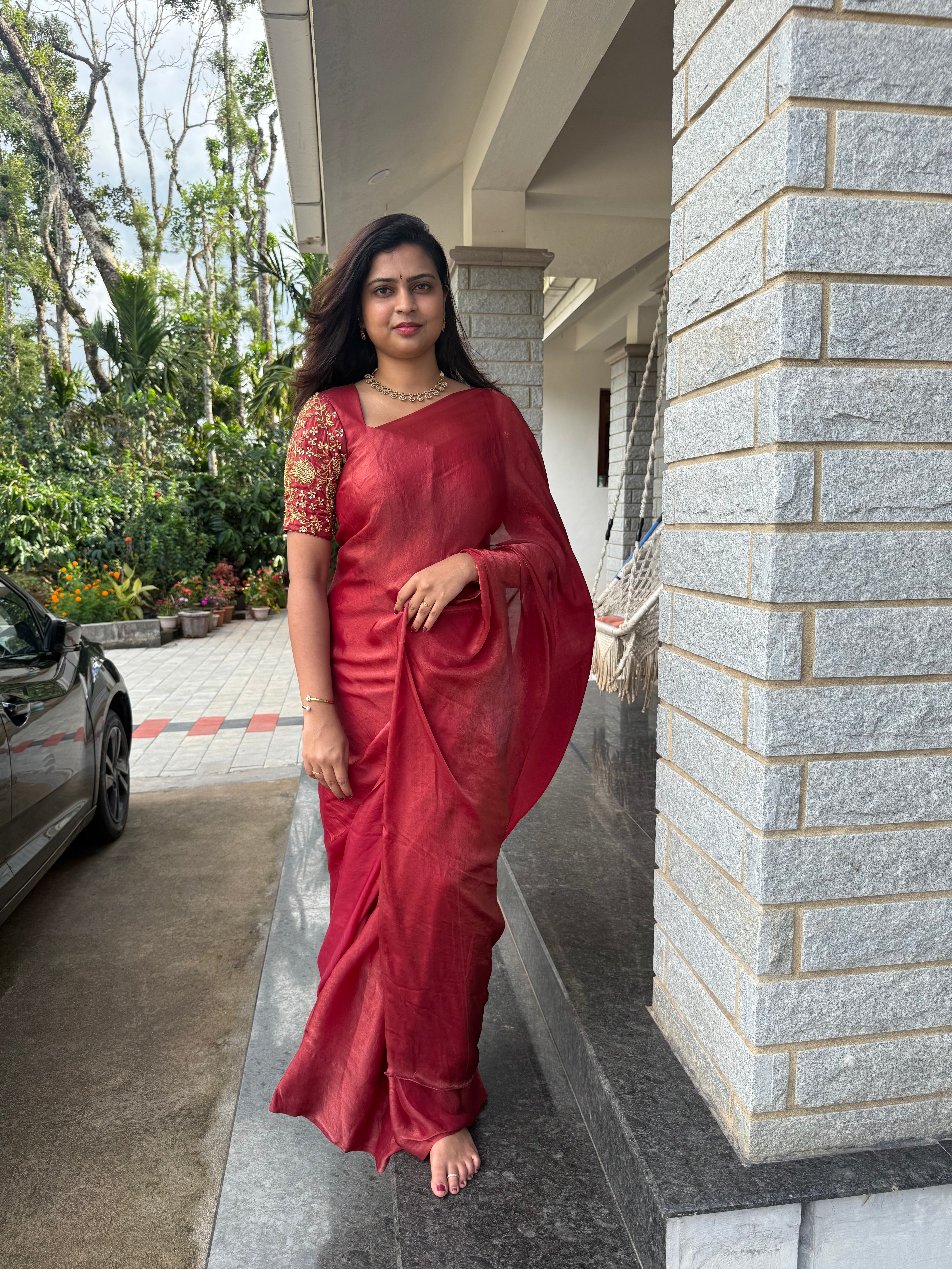 Arpitha red party wear with heavy work blouse saree