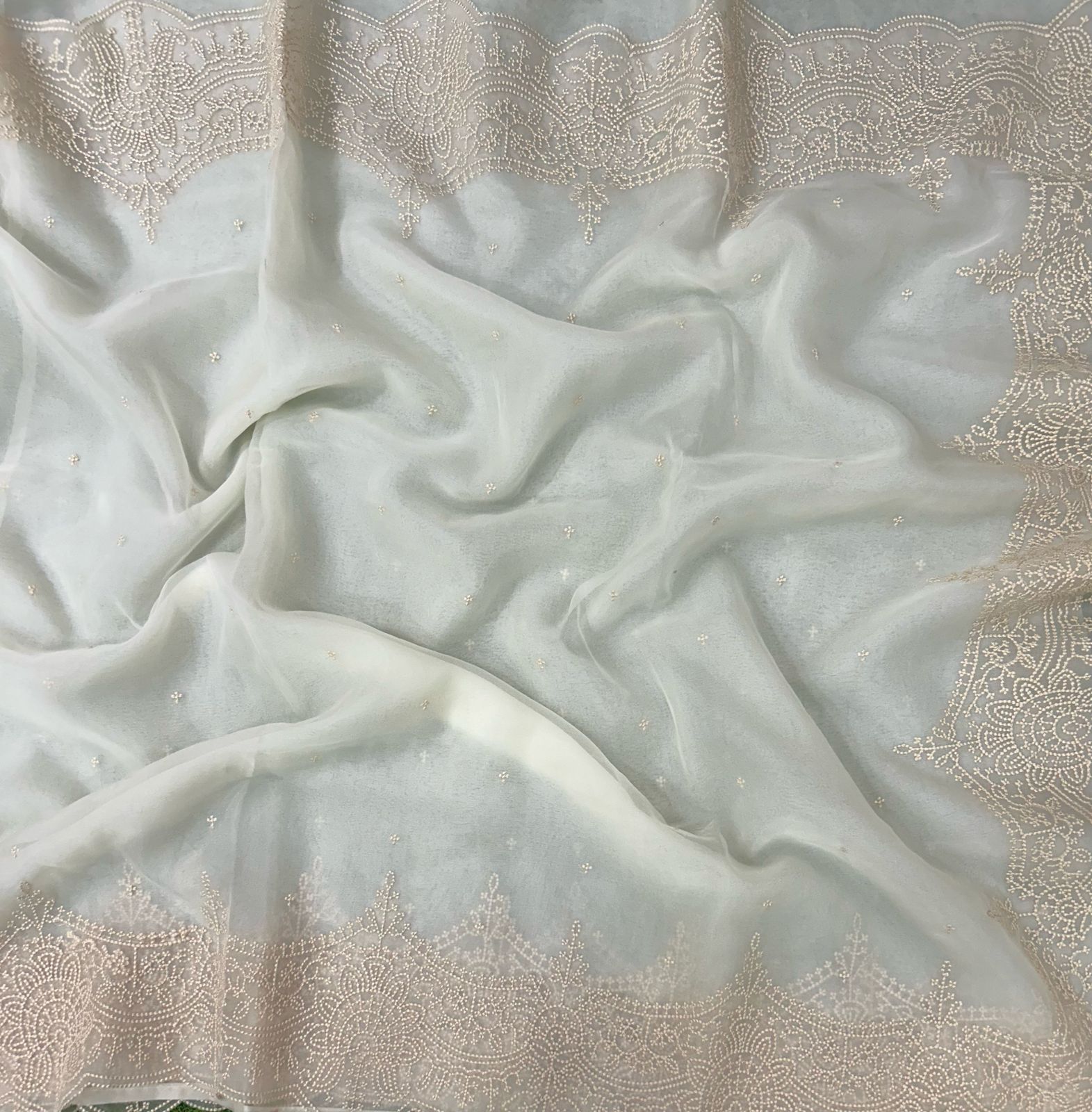 Cream embroidered scallop border saree