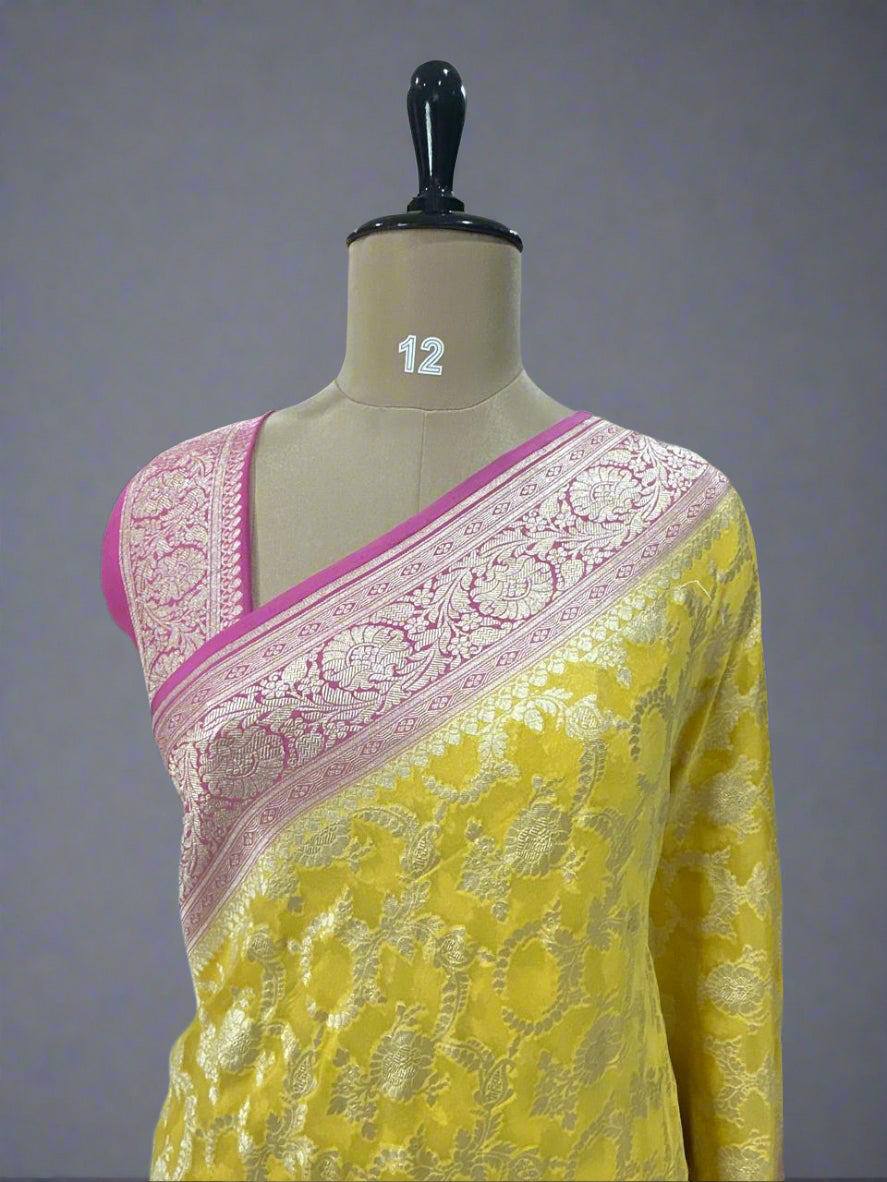 Yellow n pink jaal premium pure georgette saree