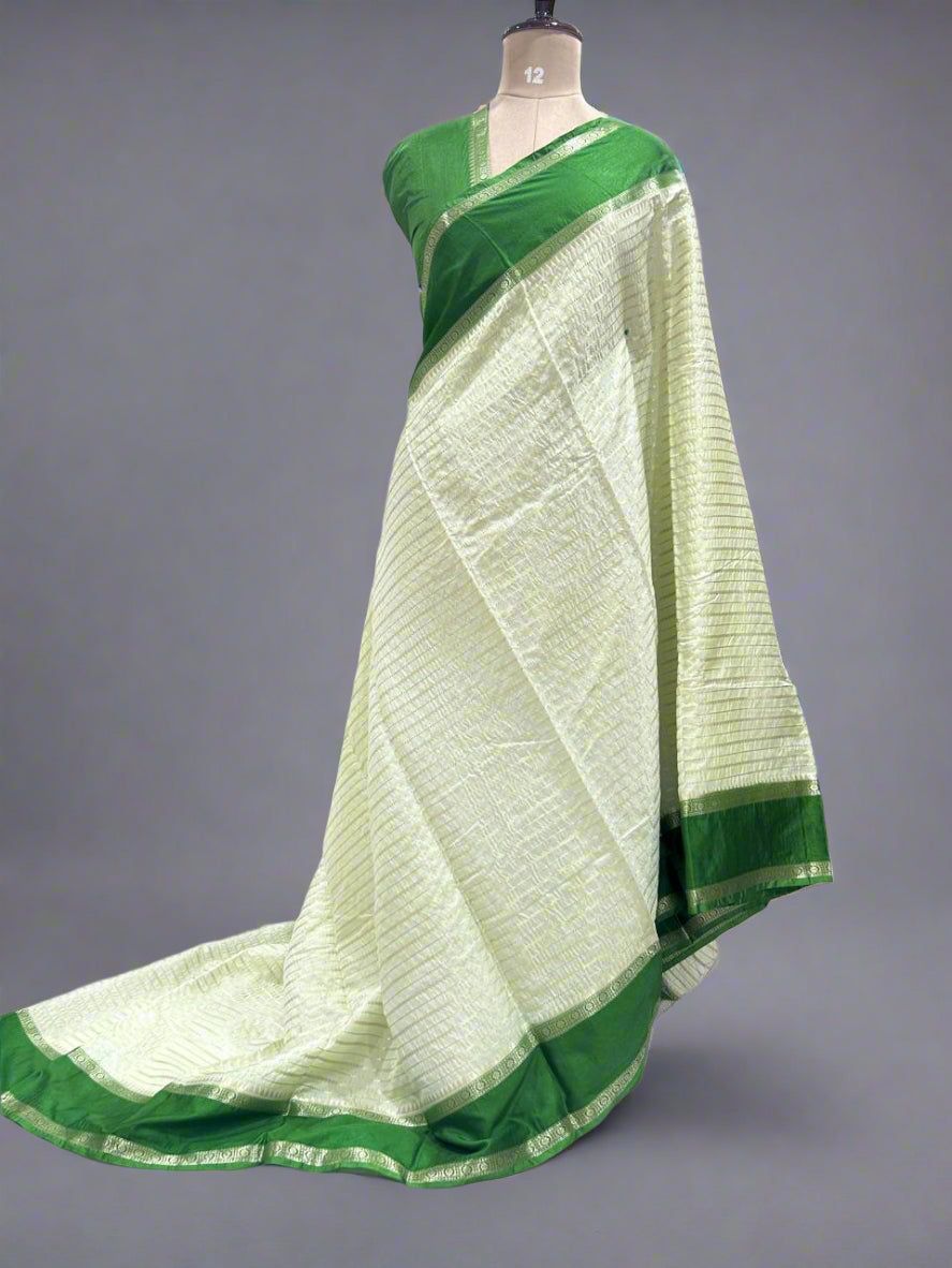 Pista green gadwal border semi chiniya silk saree