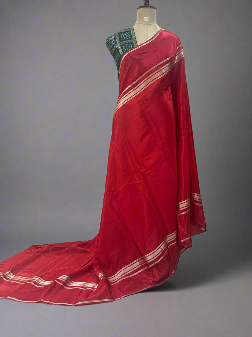 Red plain four border semi mysore crepe saree