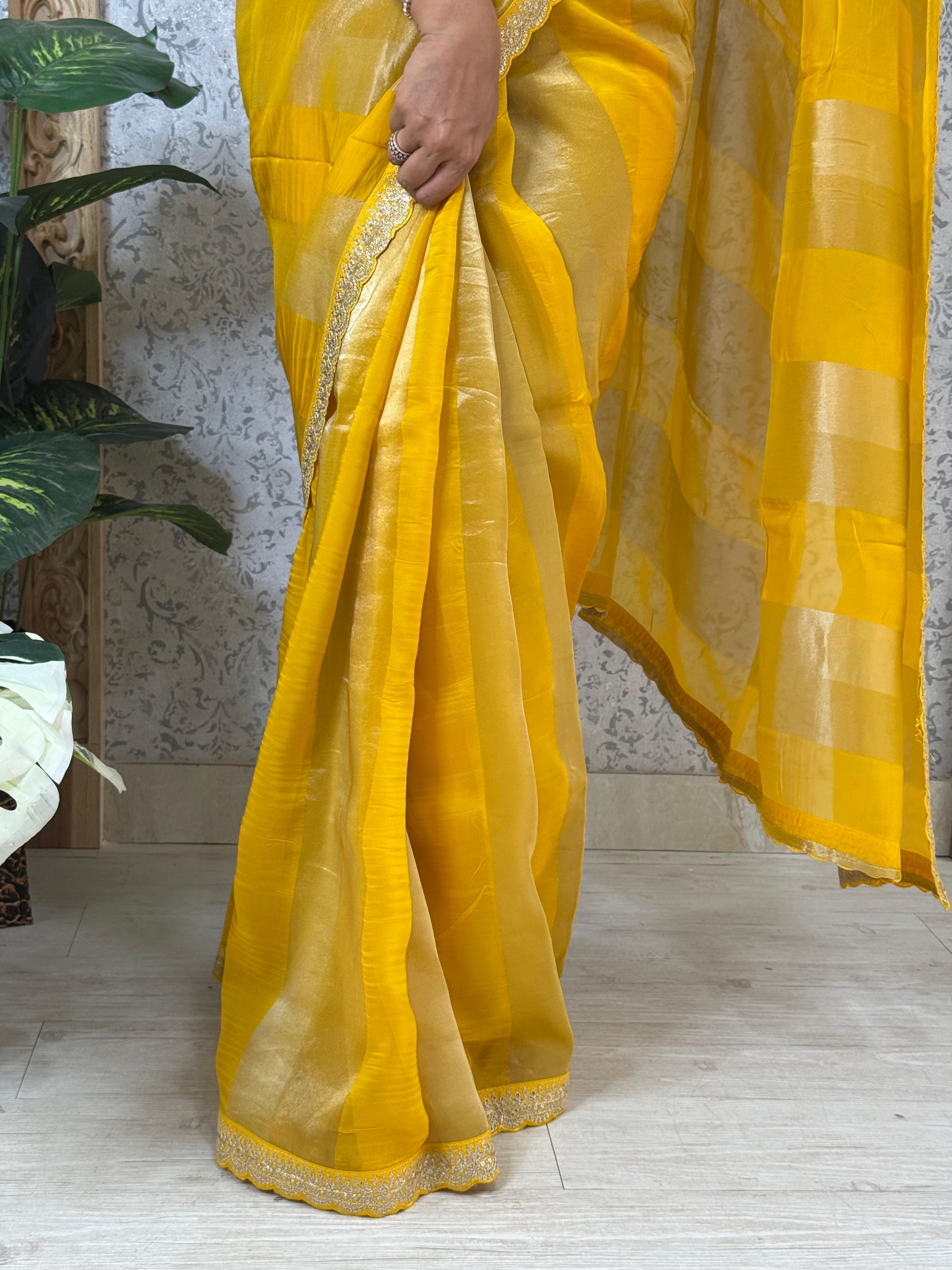 Yellow sabyasachi stripes with bandhini design blouse saree