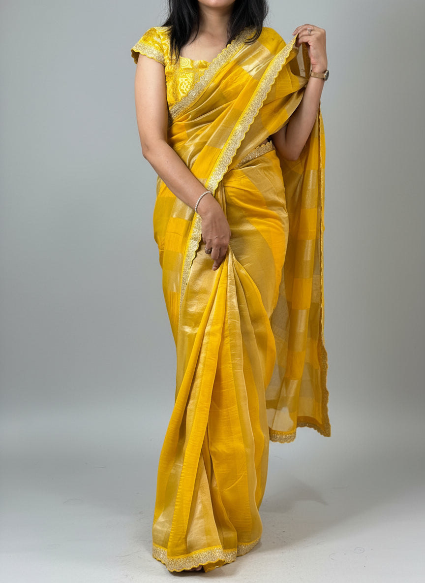Yellow sabyasachi stripes with bandhini design blouse saree