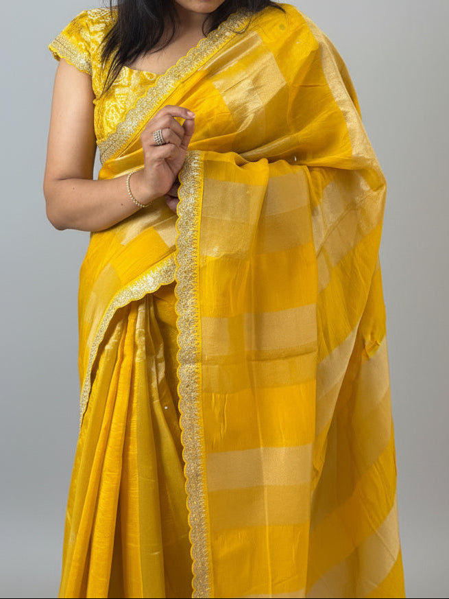 Yellow sabyasachi stripes with bandhini design blouse saree