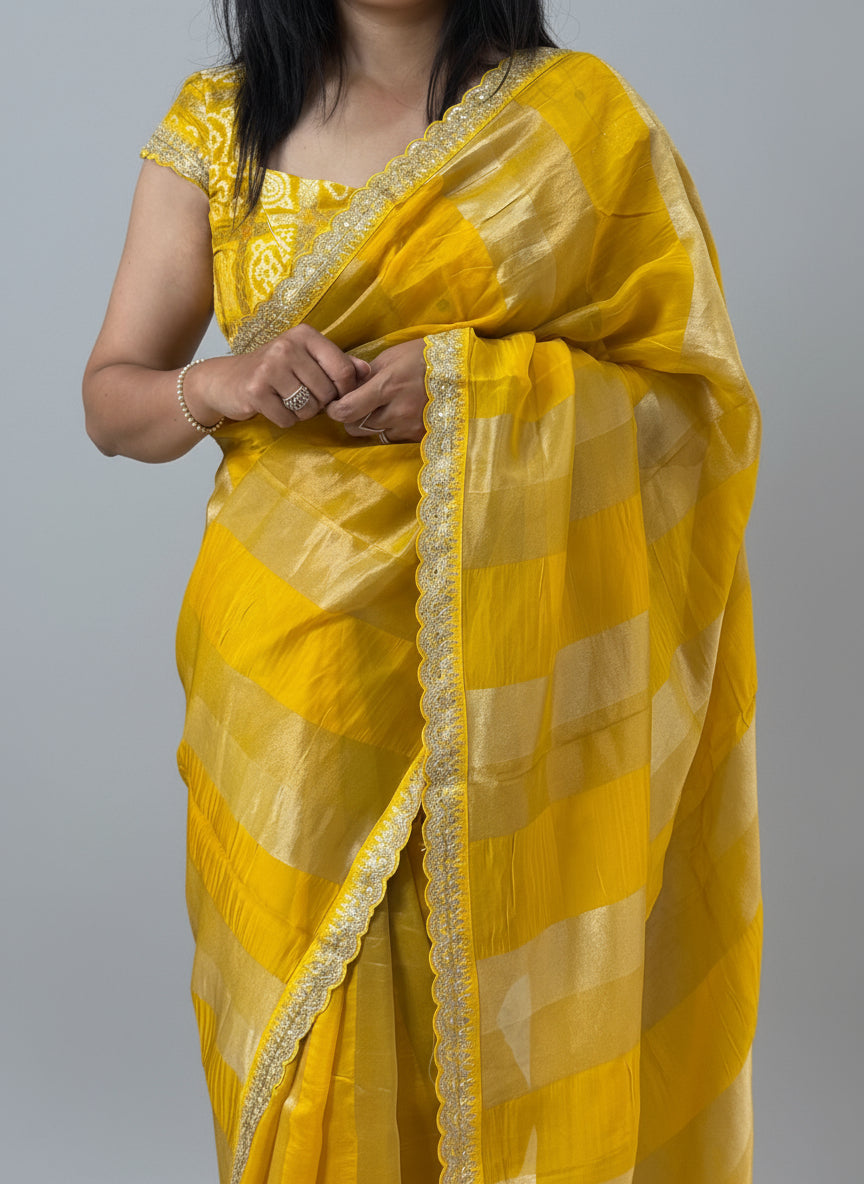 Yellow sabyasachi stripes with bandhini design blouse saree
