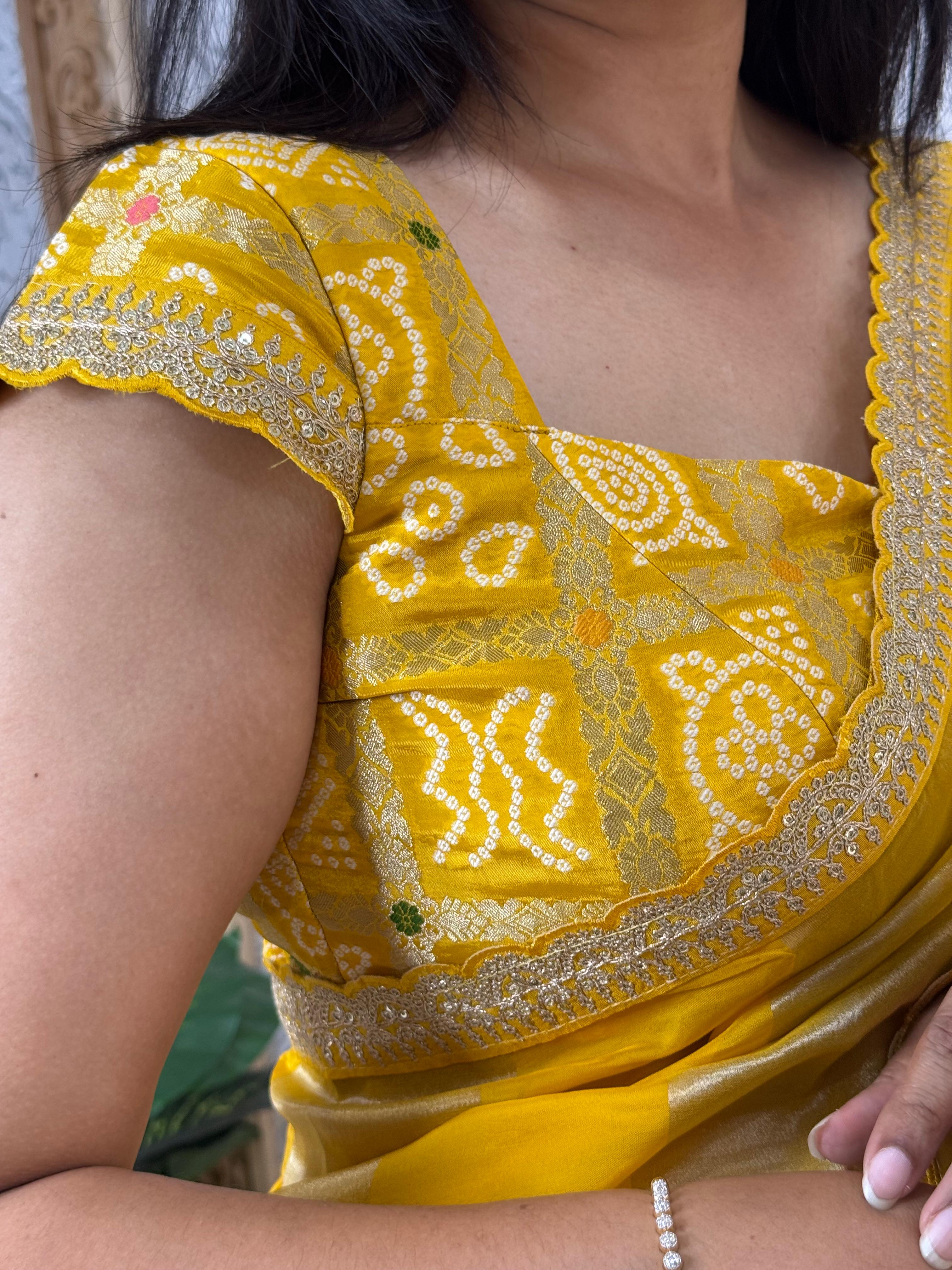 Yellow sabyasachi stripes with bandhini design blouse saree