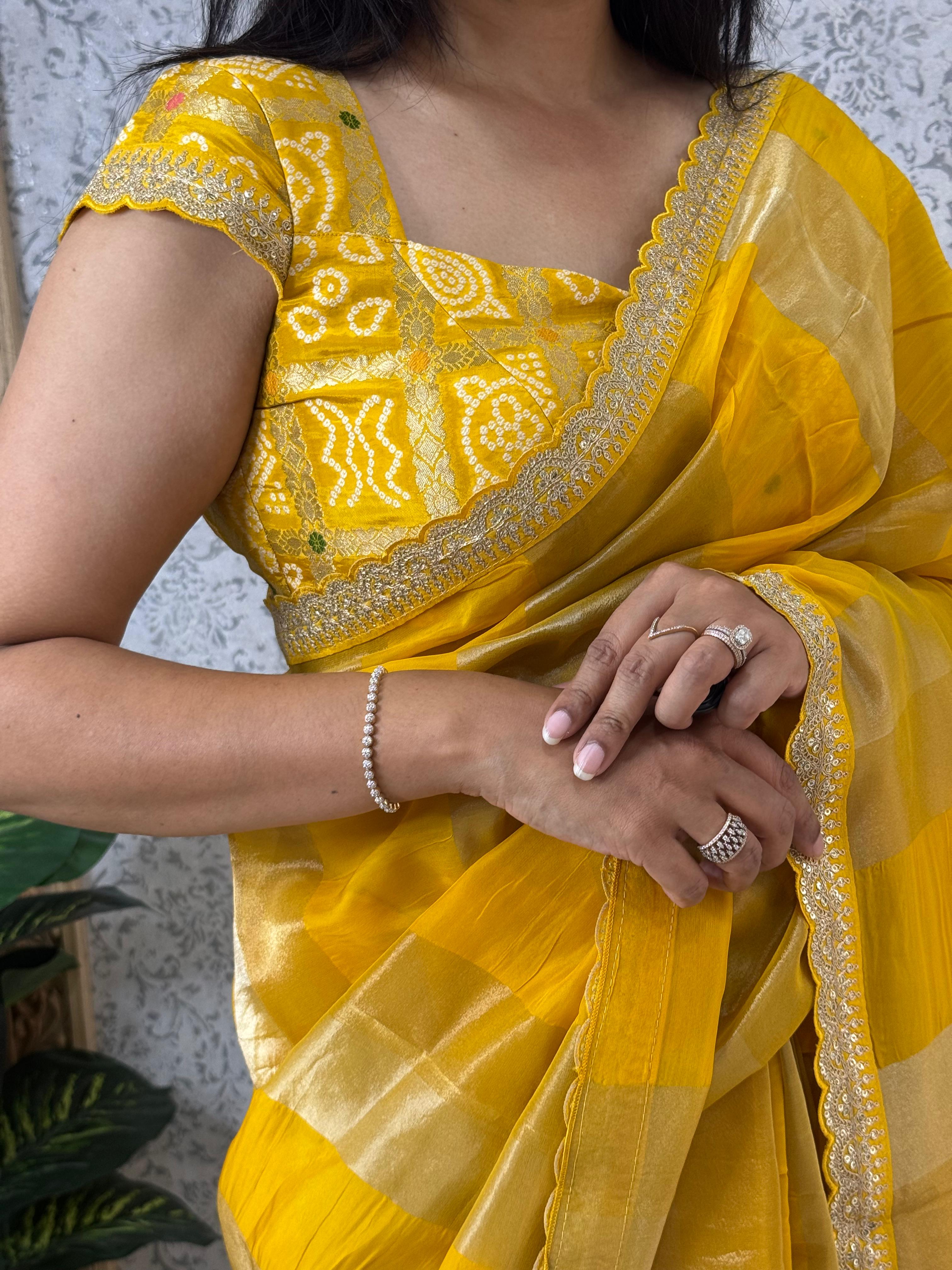 Yellow sabyasachi stripes with bandhini design blouse saree