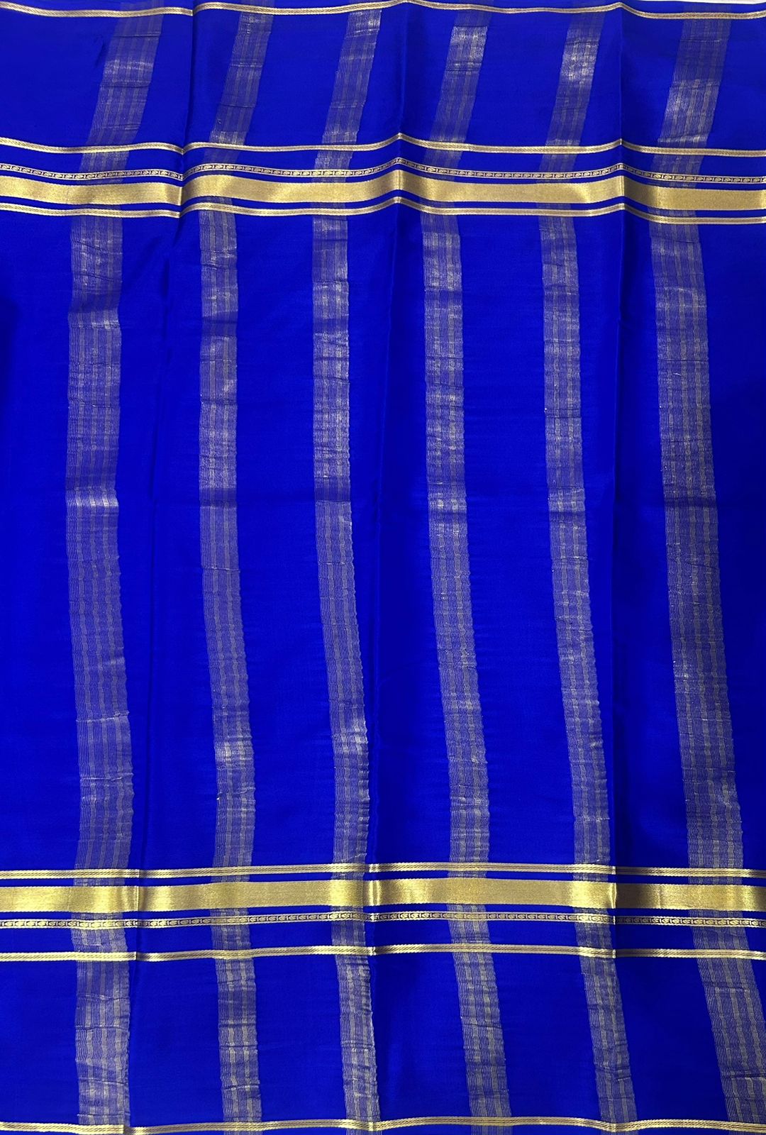 Royal blue plain four border pure mysore crepe silk saree