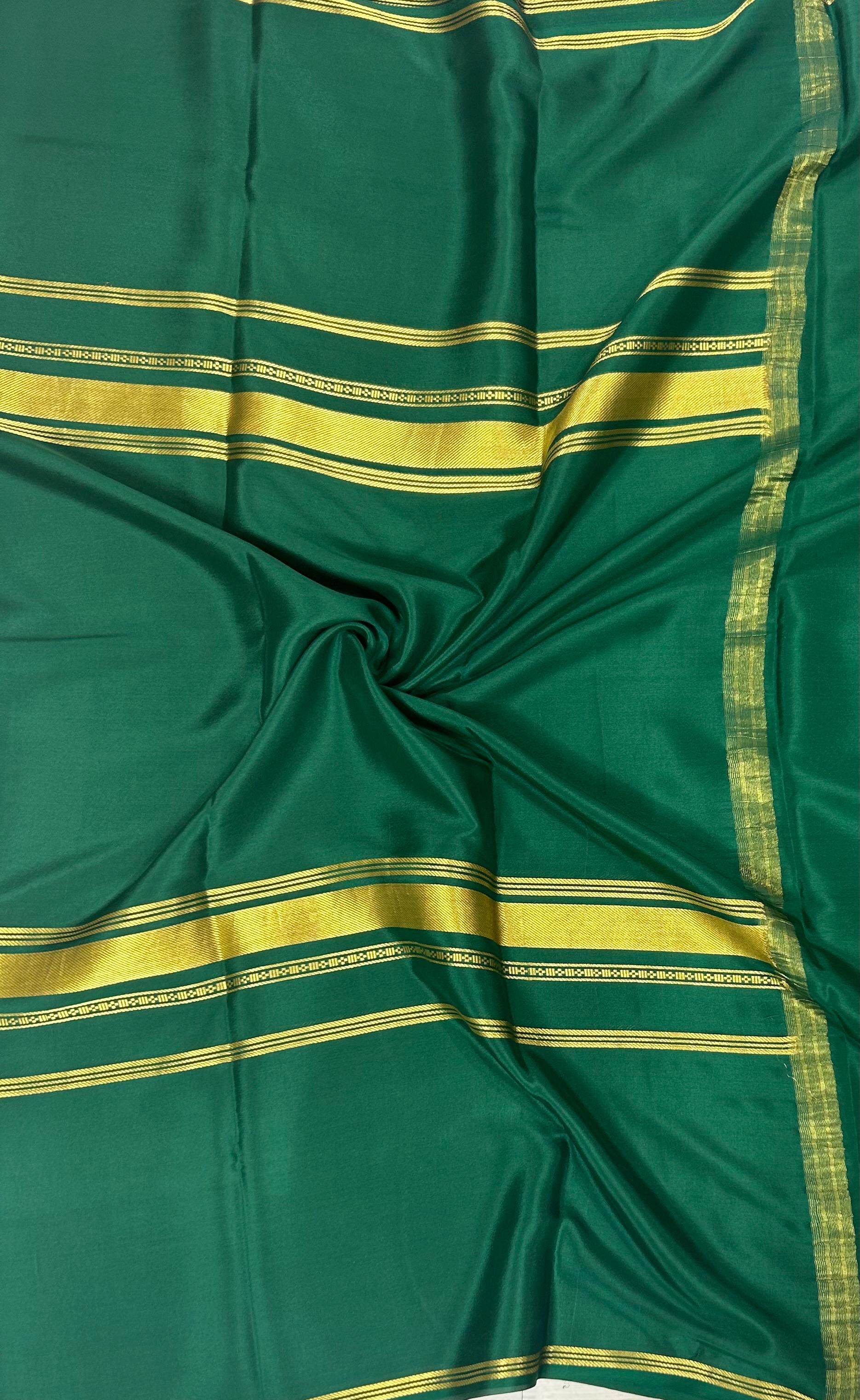 Bottle green plain four border pure mysore crepe silk saree