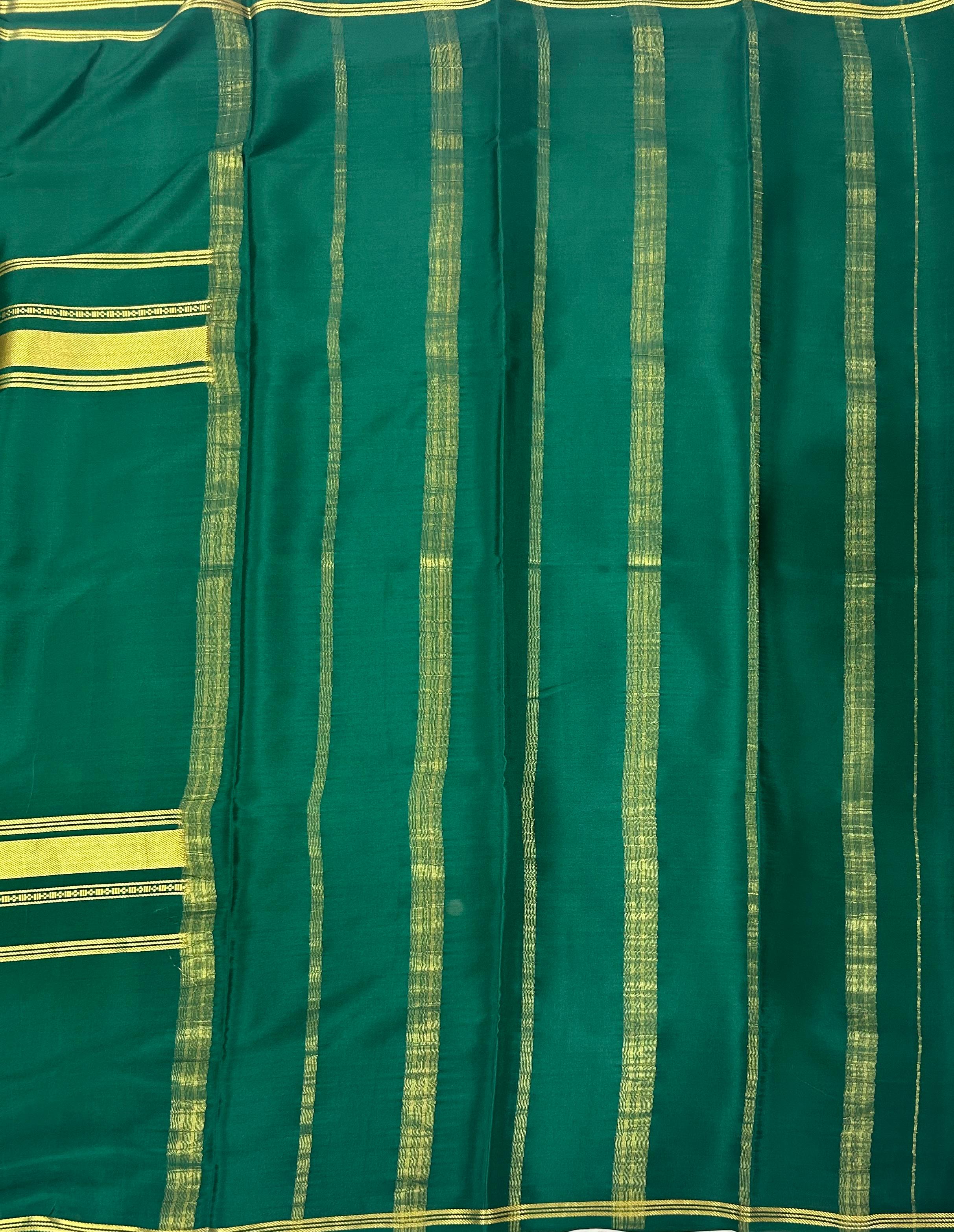 Bottle green plain four border pure mysore crepe silk saree