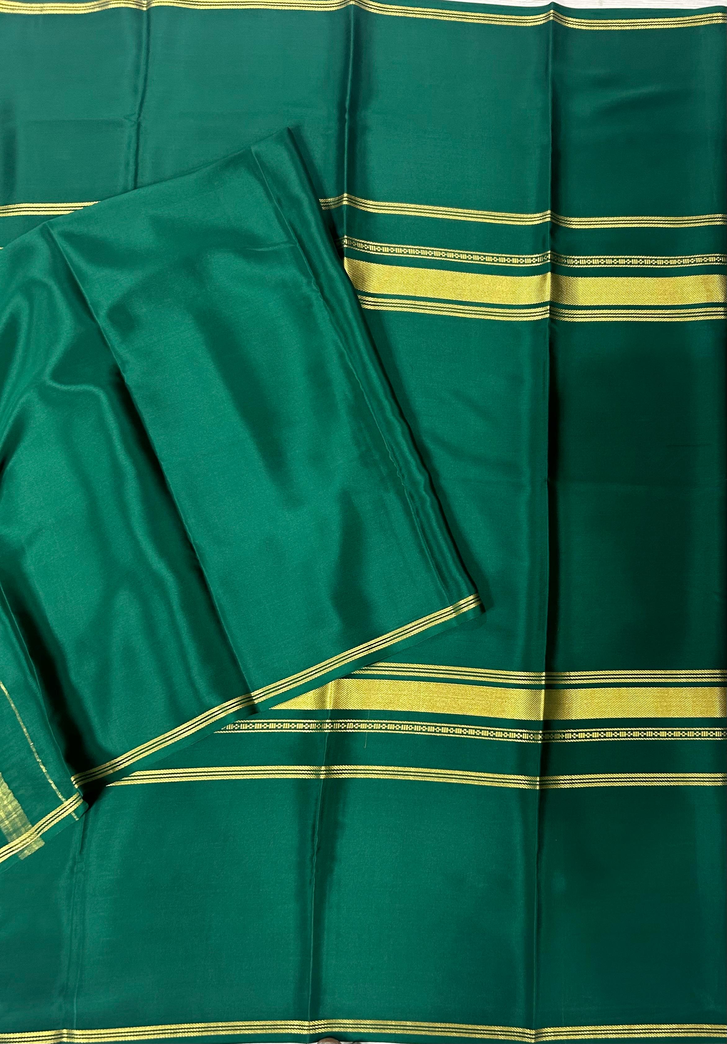 Bottle green plain four border pure mysore crepe silk saree