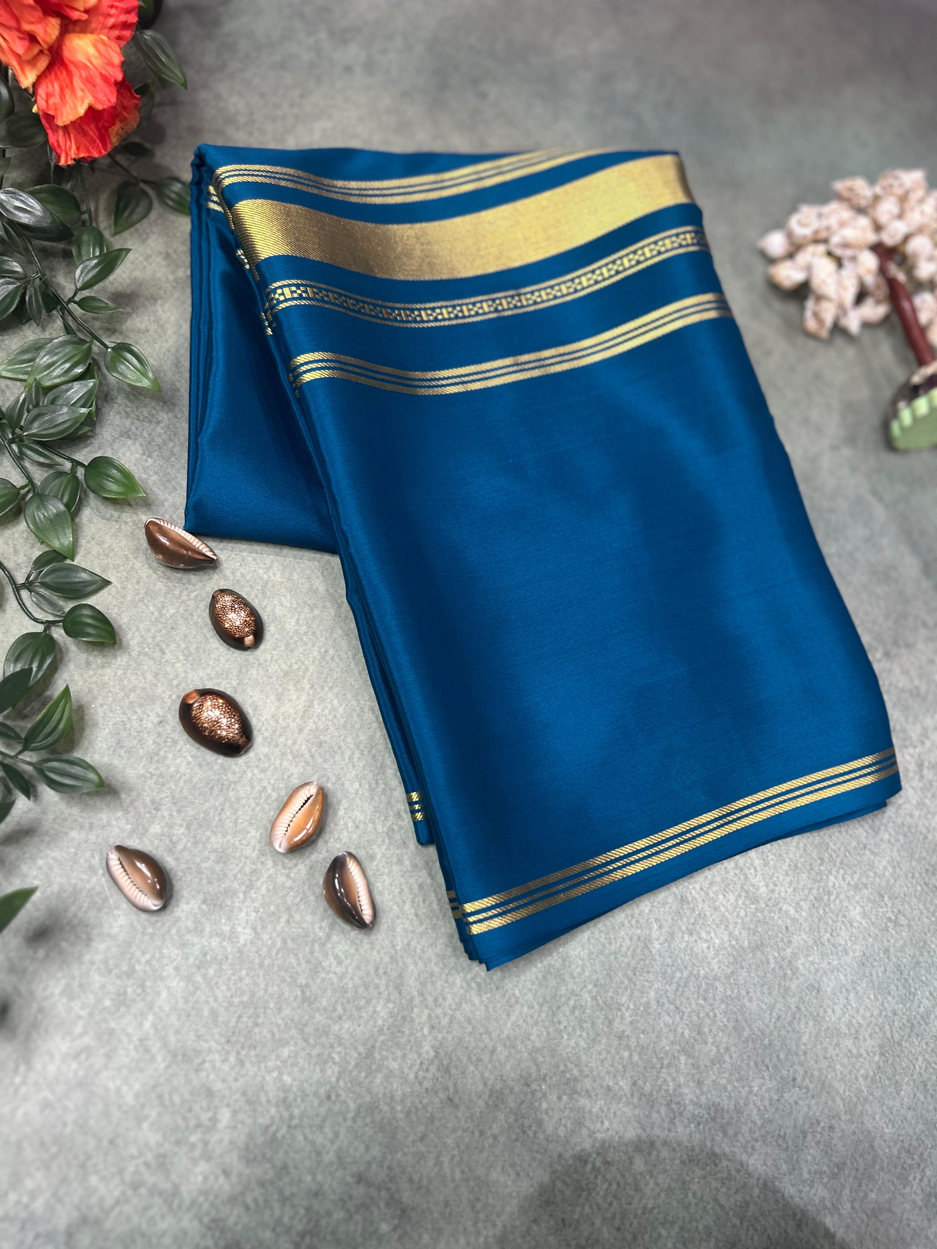 Peacock blue plain four border pure mysore crepe silk saree