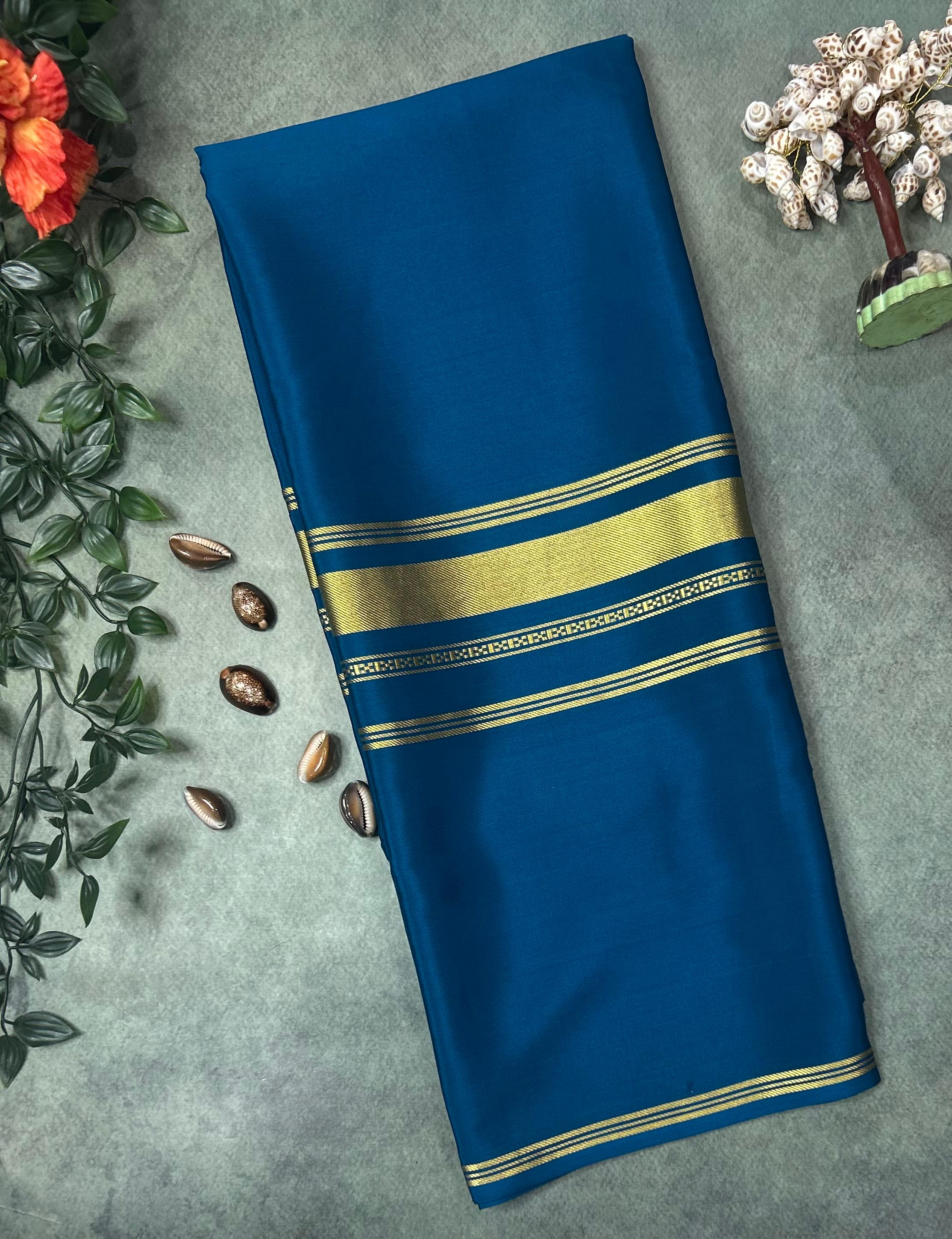 Peacock blue plain four border pure mysore crepe silk saree
