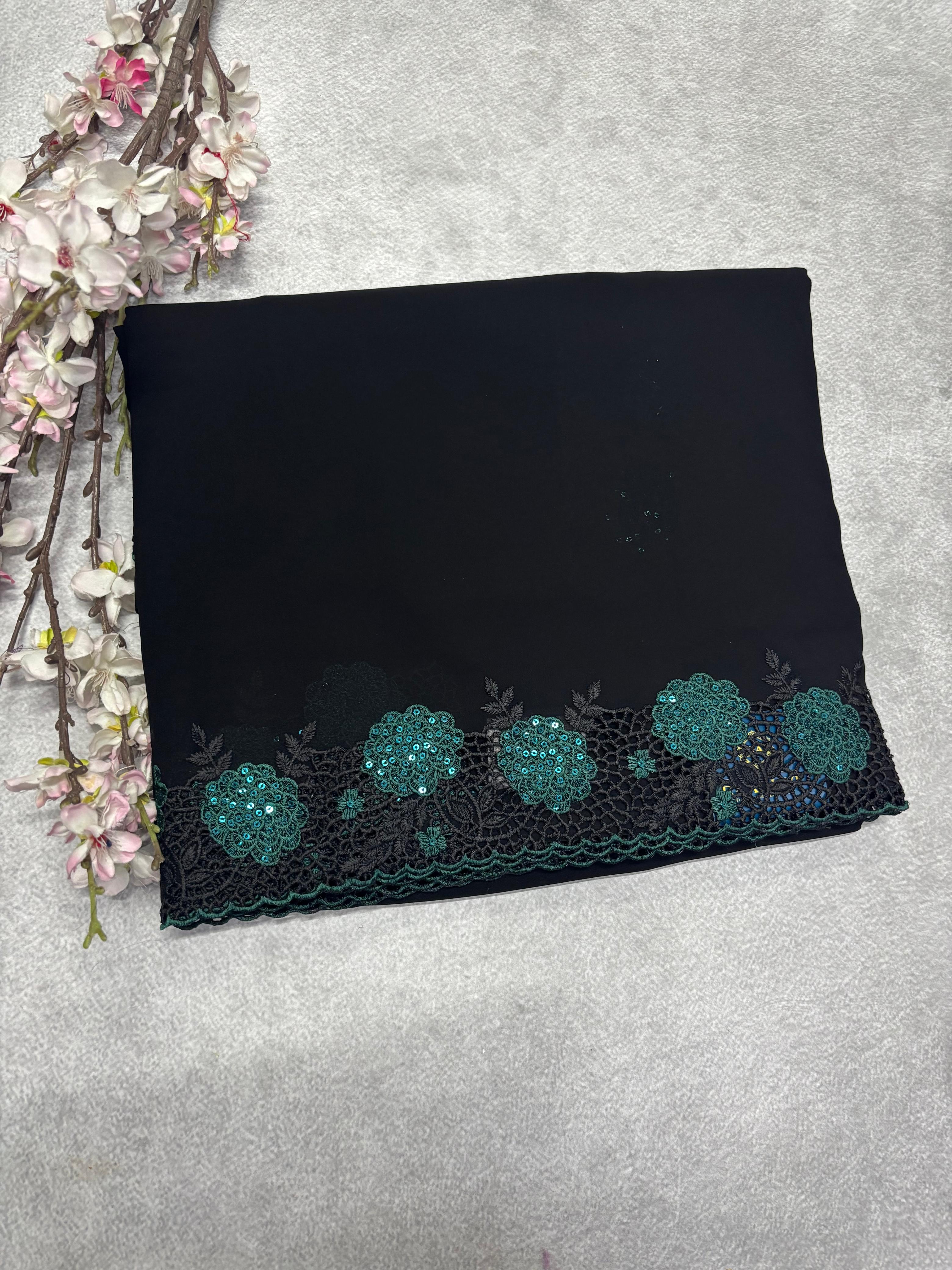 Black with green cut work border embroidery georgette