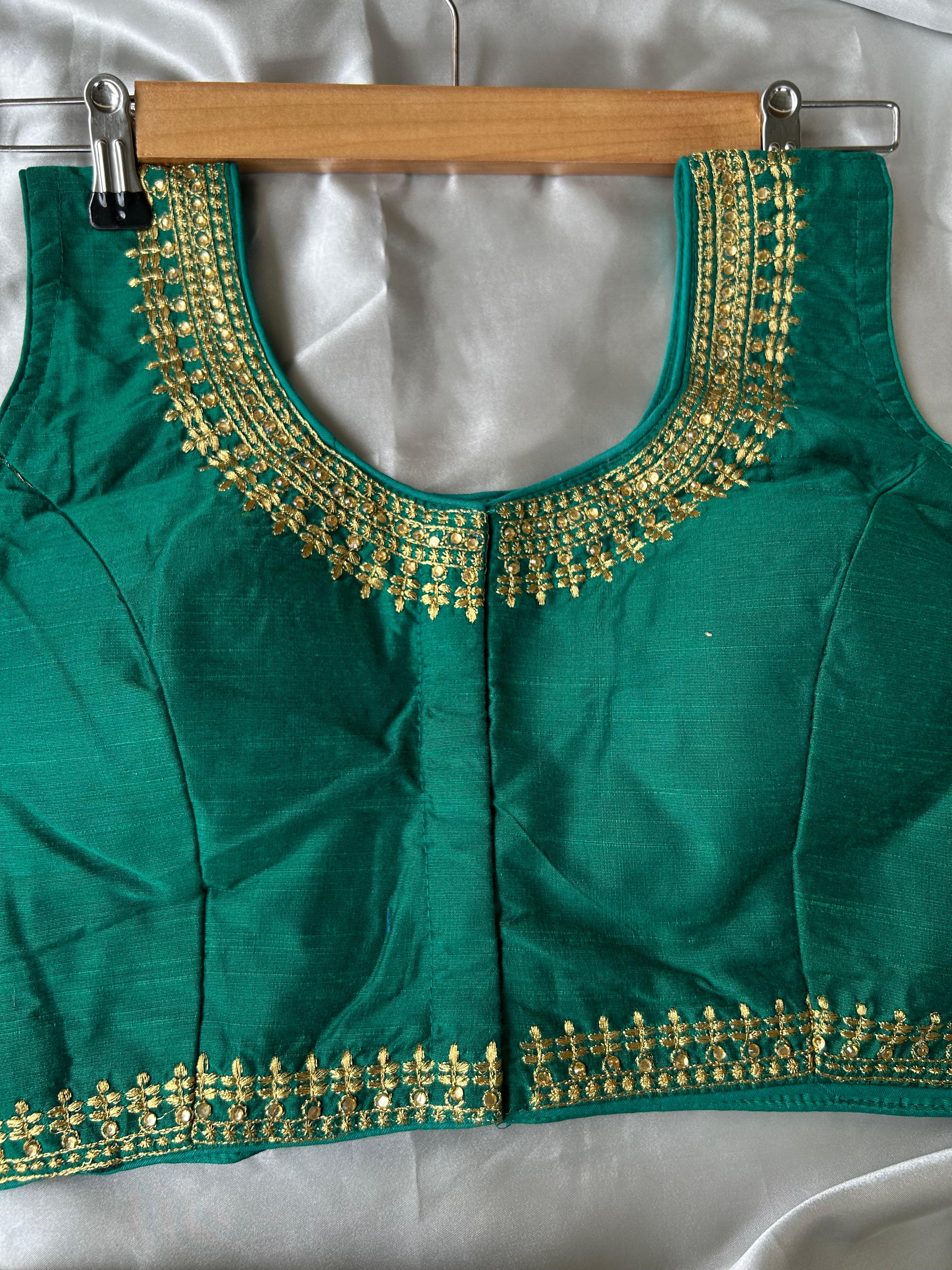 Green sleeveless full stone work blouse (