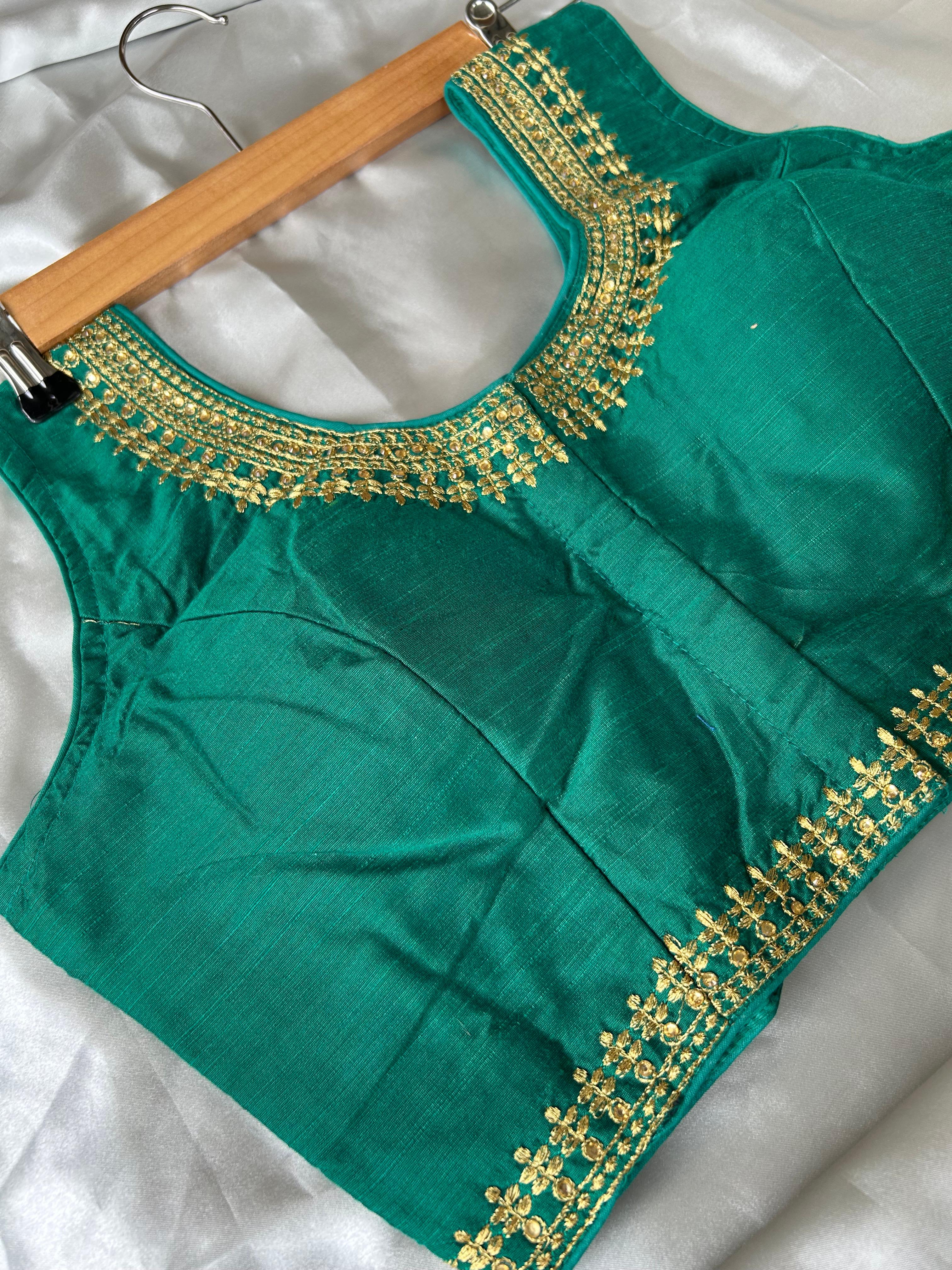 Green sleeveless full stone work blouse (