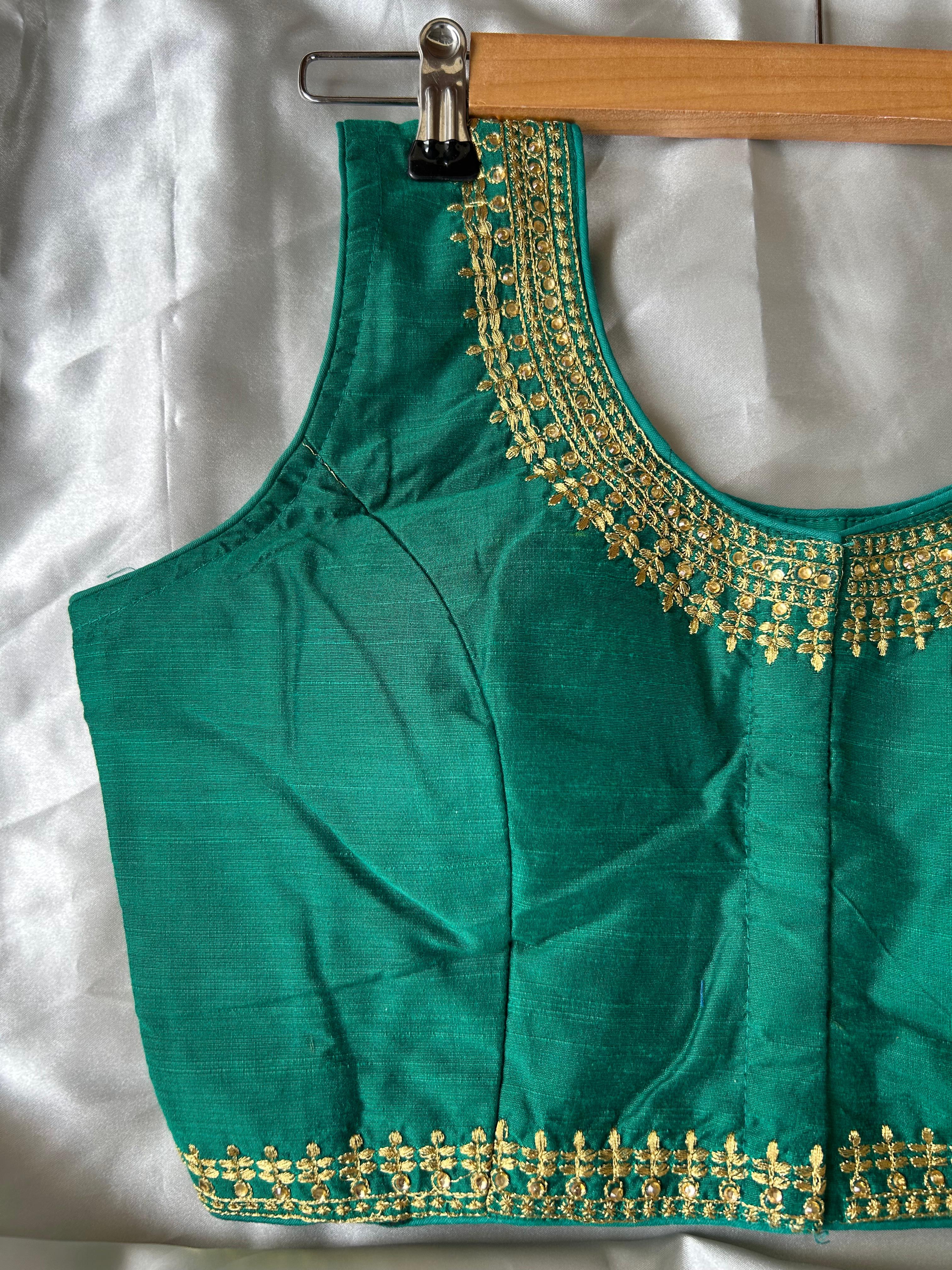 Green sleeveless full stone work blouse (