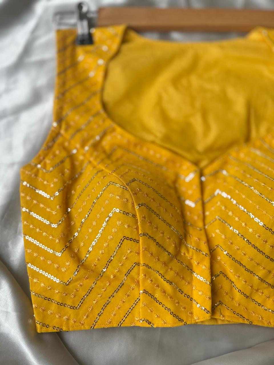 Yellow zig zag sleeveless full stone work blouse