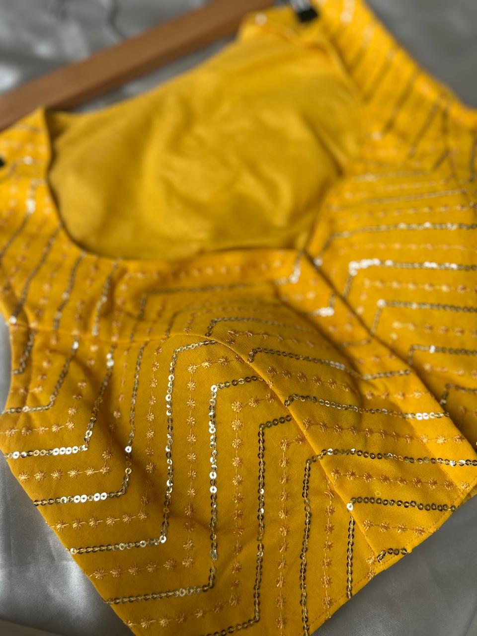 Yellow zig zag sleeveless full stone work blouse