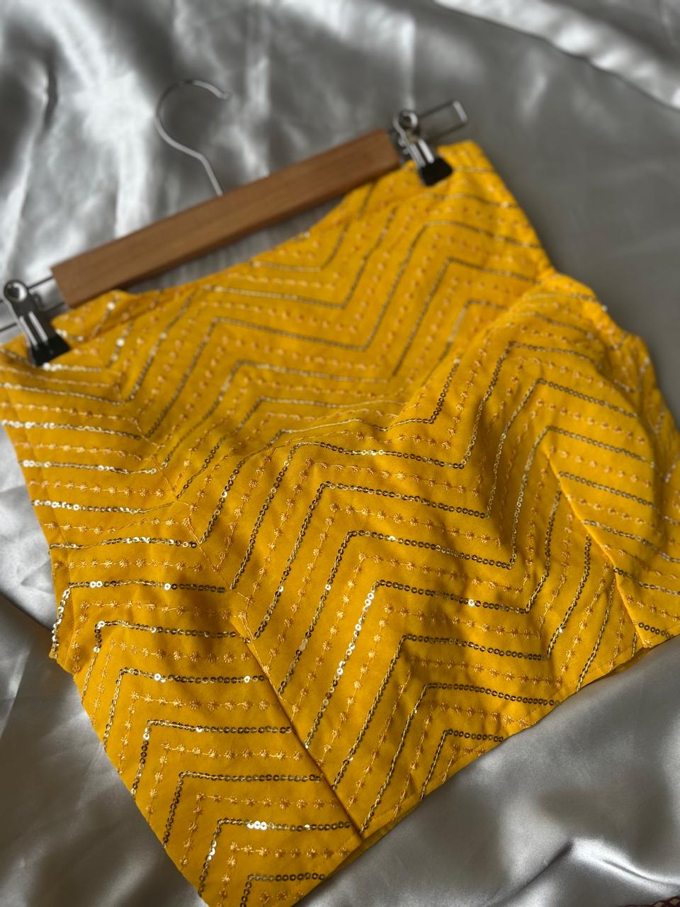 Yellow zig zag sleeveless full stone work blouse