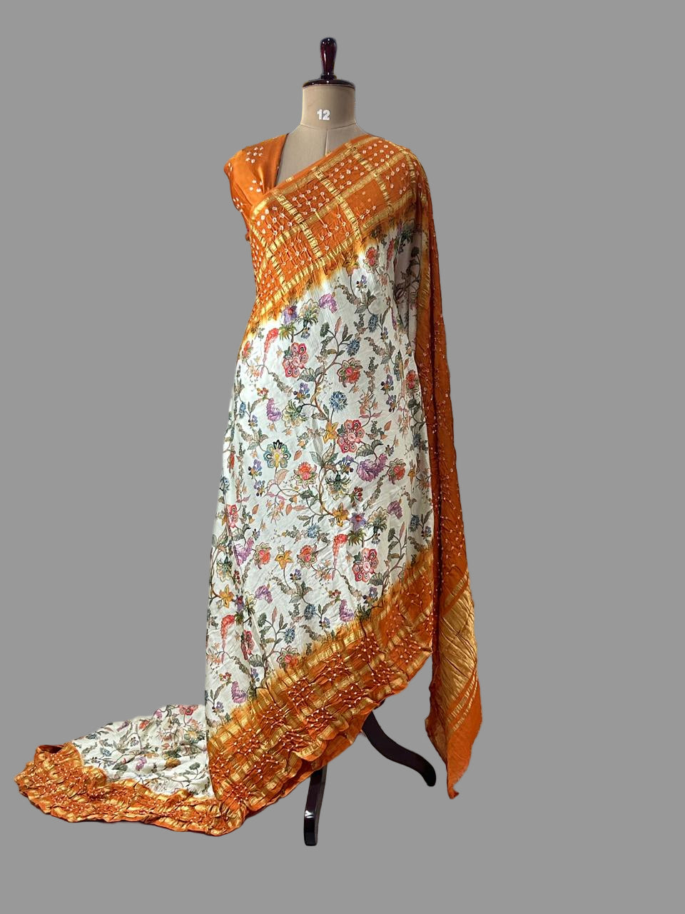 Cream n orange printed pure gajji silk with bandhini blouse saree