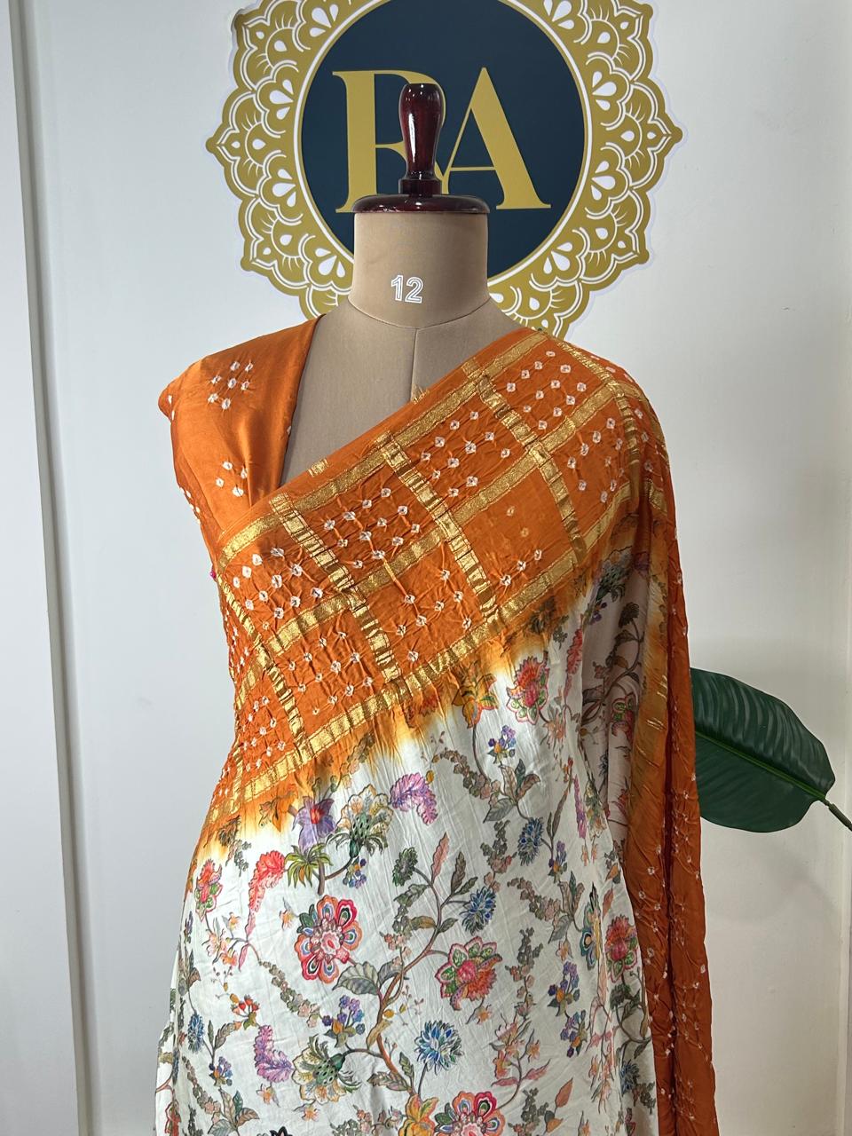 Cream n orange printed pure gajji silk with bandhini blouse saree