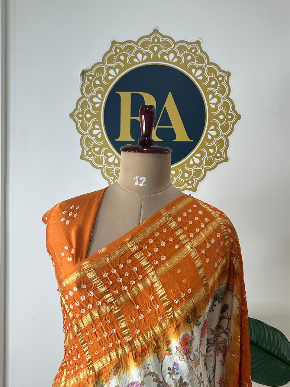 Cream n orange printed pure gajji silk with bandhini blouse saree