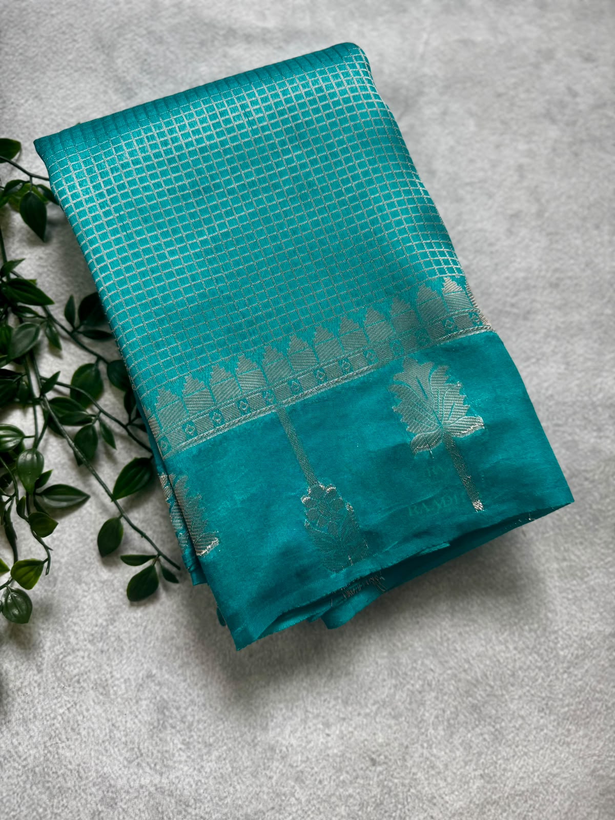 Teal checks crepe saree