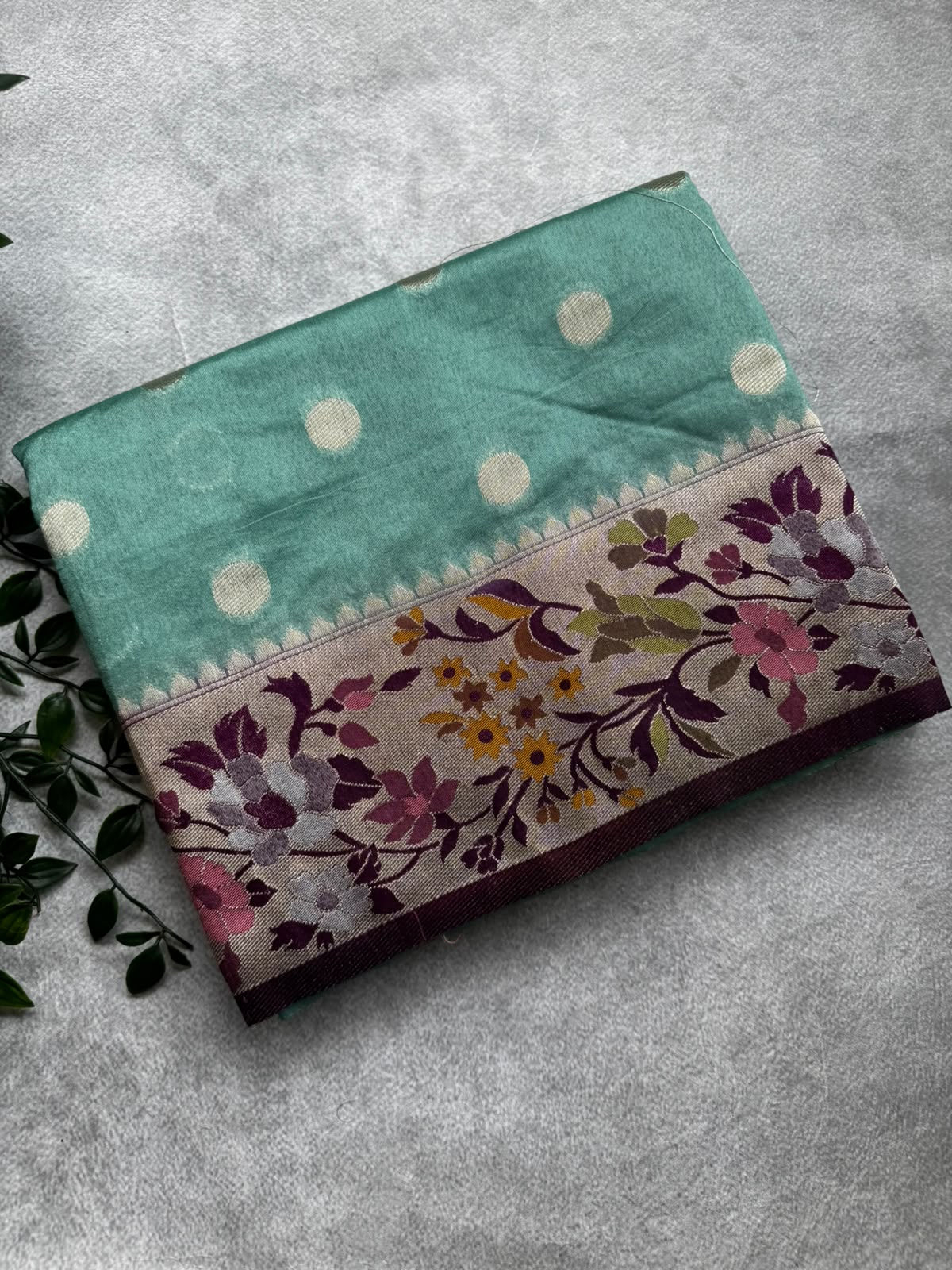 Pastel green polka dot semi crepe saree